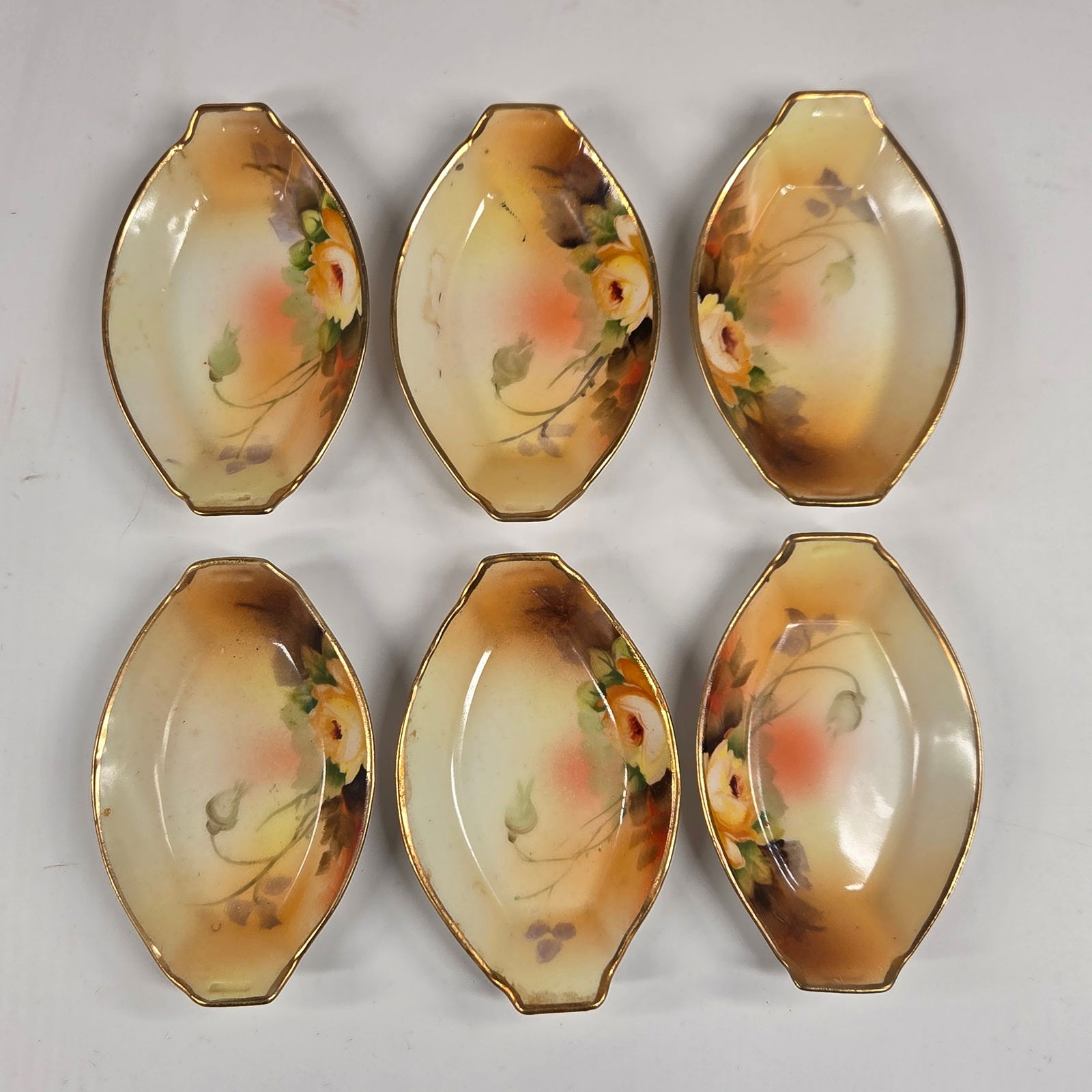 SET OF 6 NIPPON HAND PAINTED SALT / BUTTER PAT: ALL REMAIN IN GOOD CONDITION, NO CHIPS OR CRACKS.