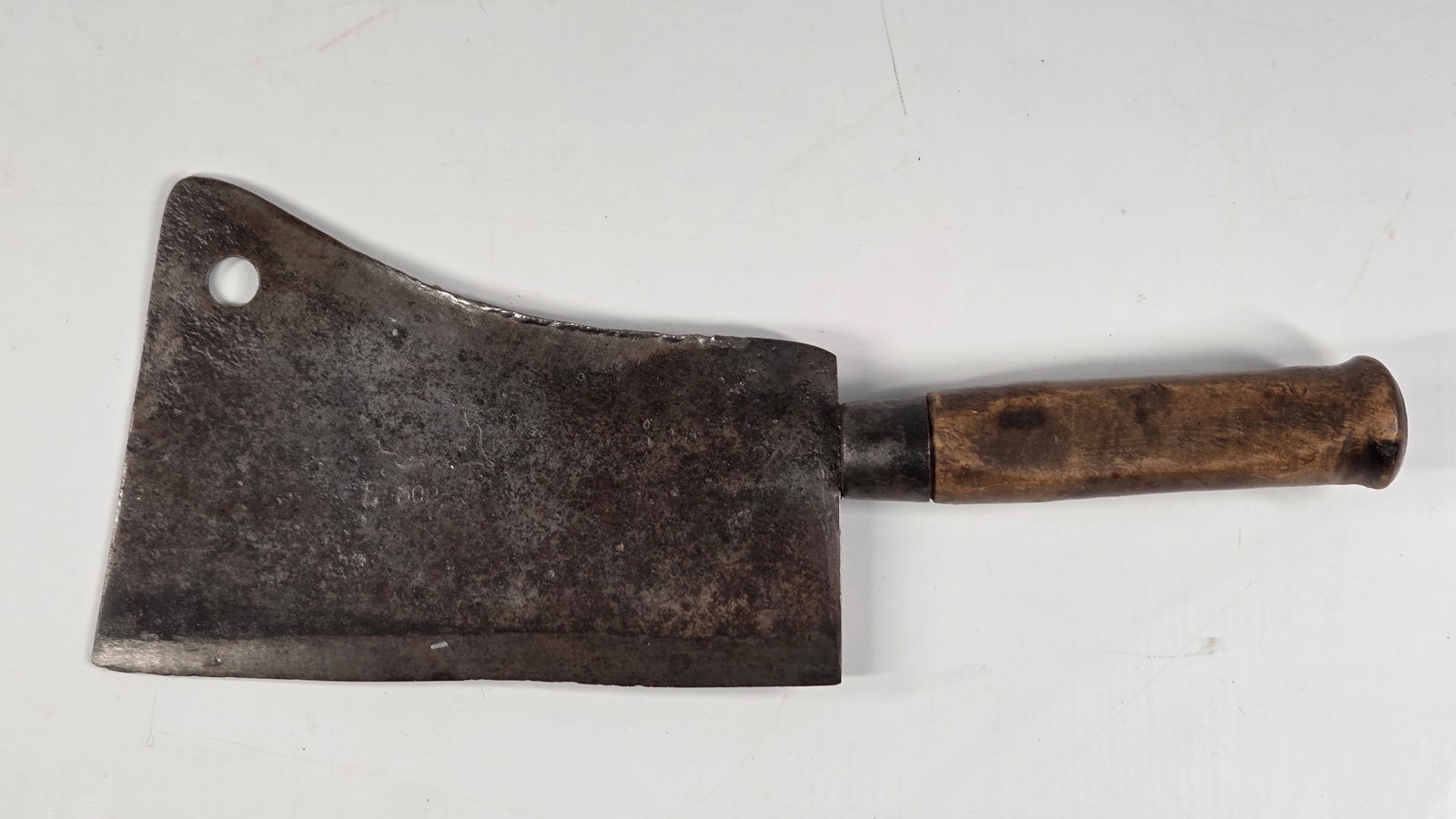 ANTIQUE MEAT CLEAVER E-503 9": REMAINS IN FAIR CONDITION, SHOWING USAGE WEAR THROUGHOUT.