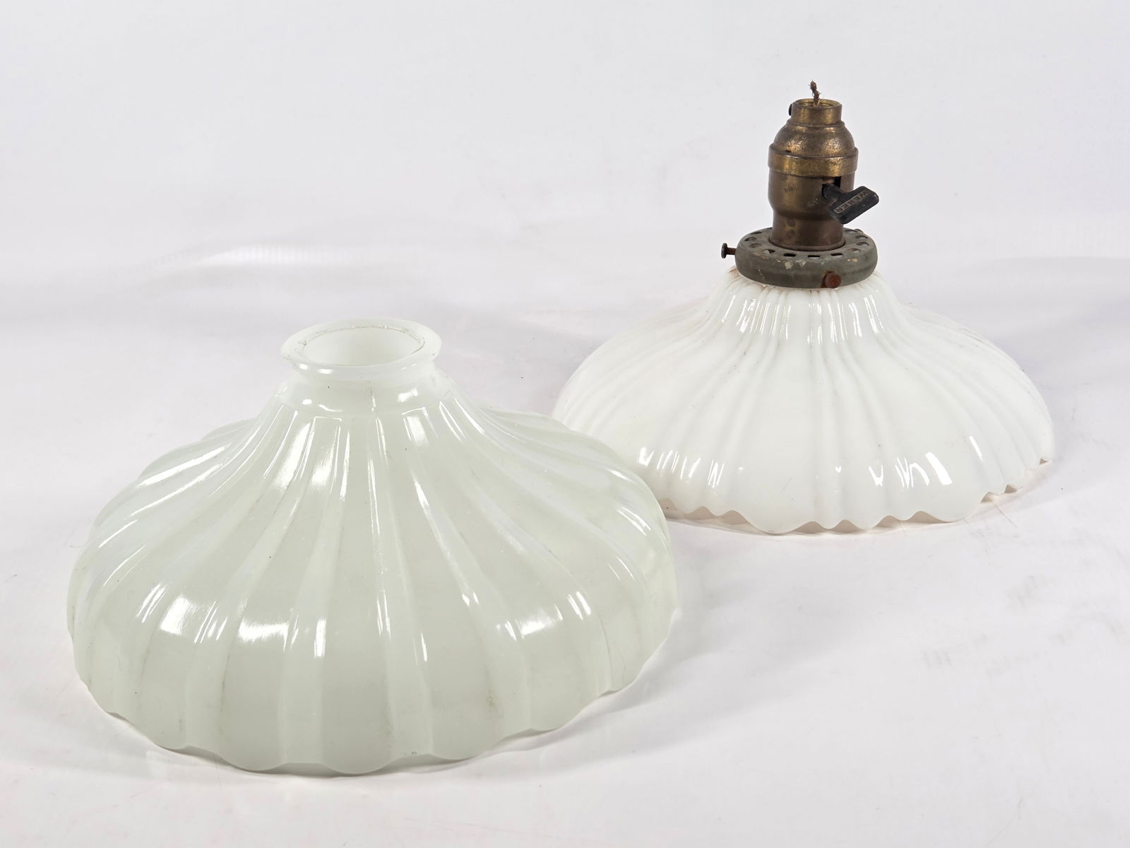 PAIR OF ANTIQUE MILK GLASS LAMP SHADES: BOTH REMAIN IN GOOD CONDITION, SHOWING SOME TYPICAL WEAR.