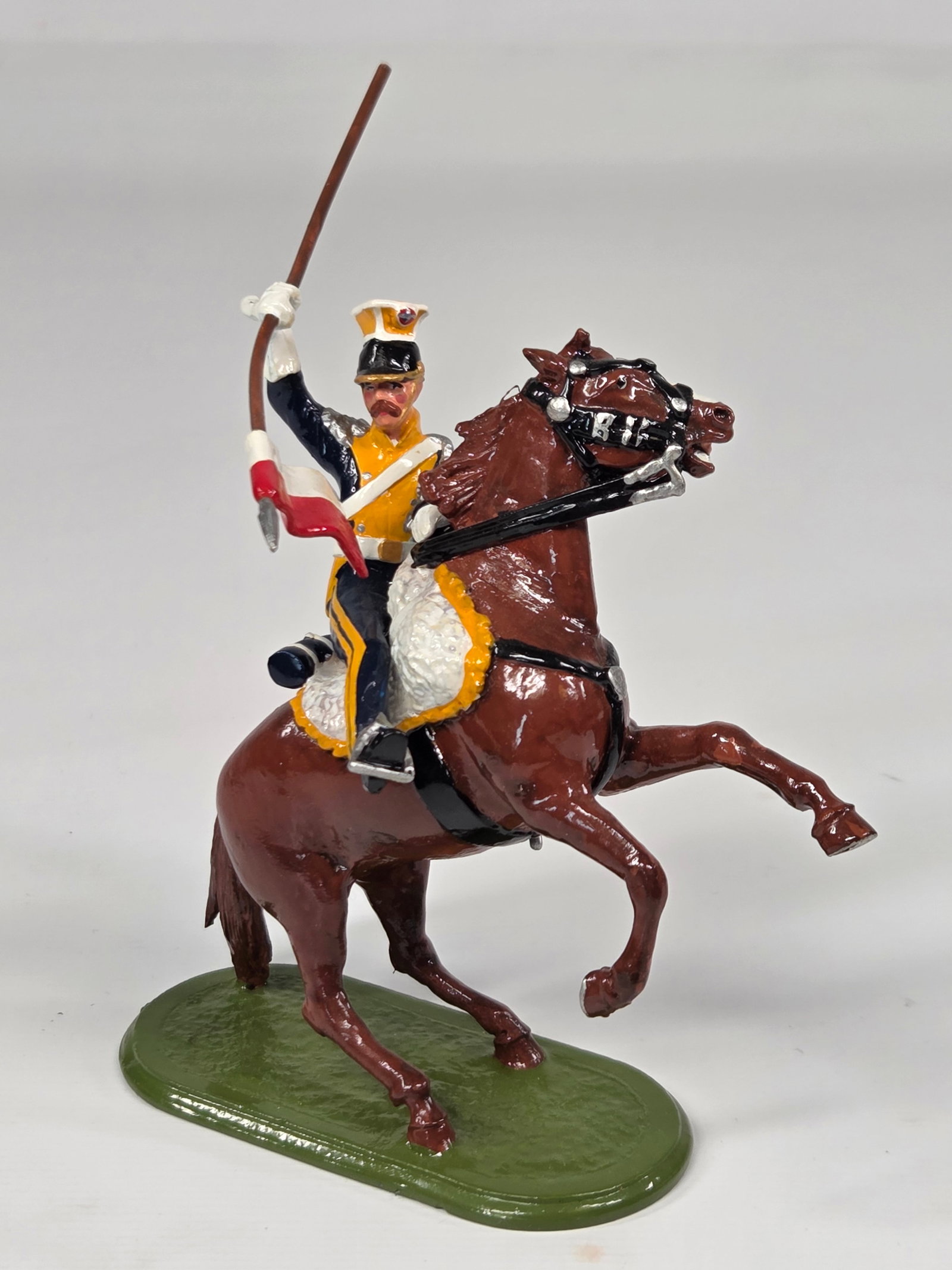 HAND PAINTED MOUNTED POLISH LANCER UNMARKED: REMAINS IN VERY GOOD CONDITION, SHOWING SOME LIGHT WEAR.