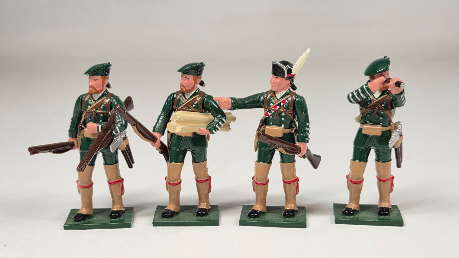 SET OF 4 HAND PAINTED SOLDIERS OF THE WORLD: ALL REMAIN IN VERY GOOD CONDITION.
