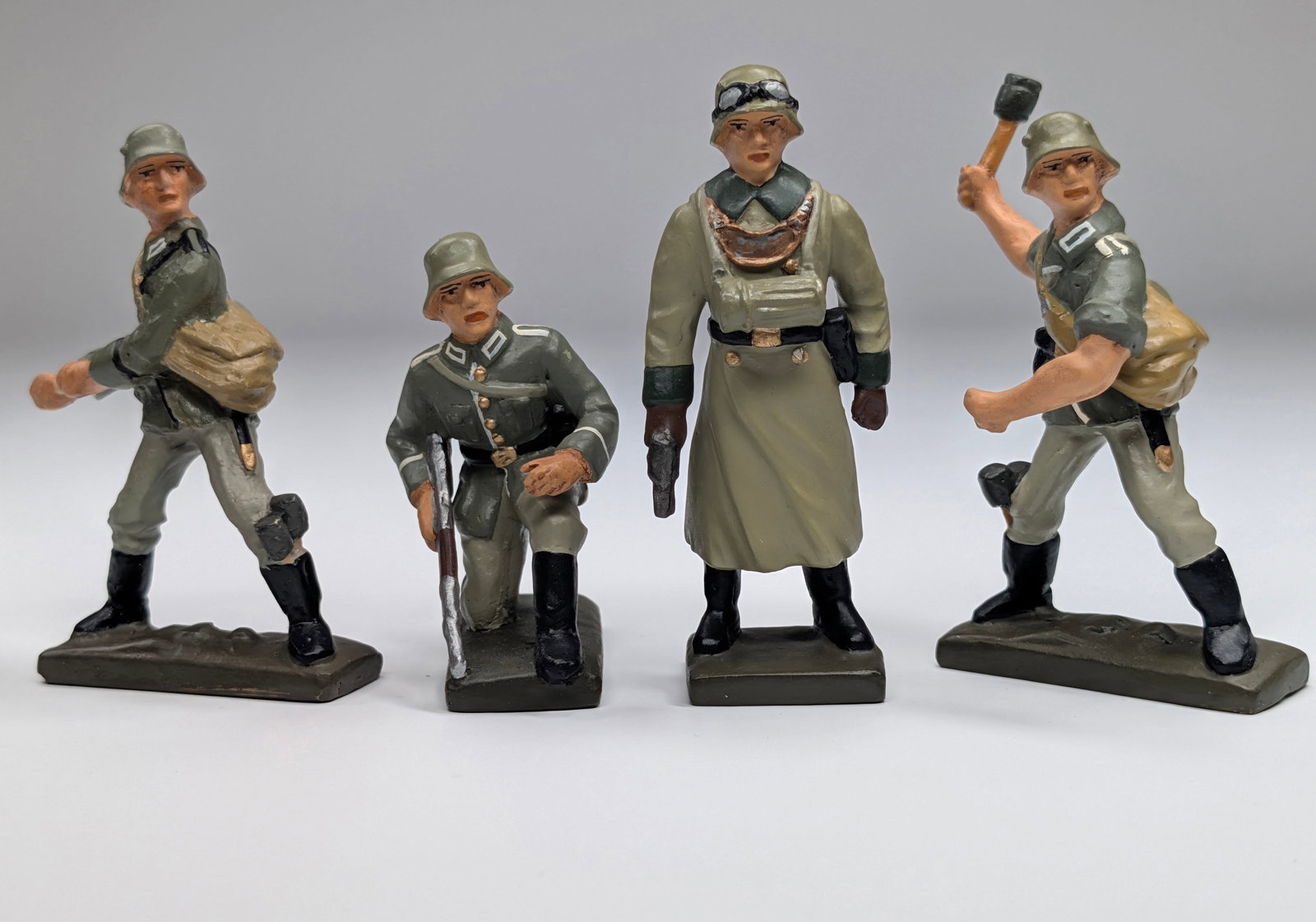 SET OF 4 HAND PAINTED "RK" GERMAN SOLDIERS: ALL REMAIN IN GOOD CONDITION.