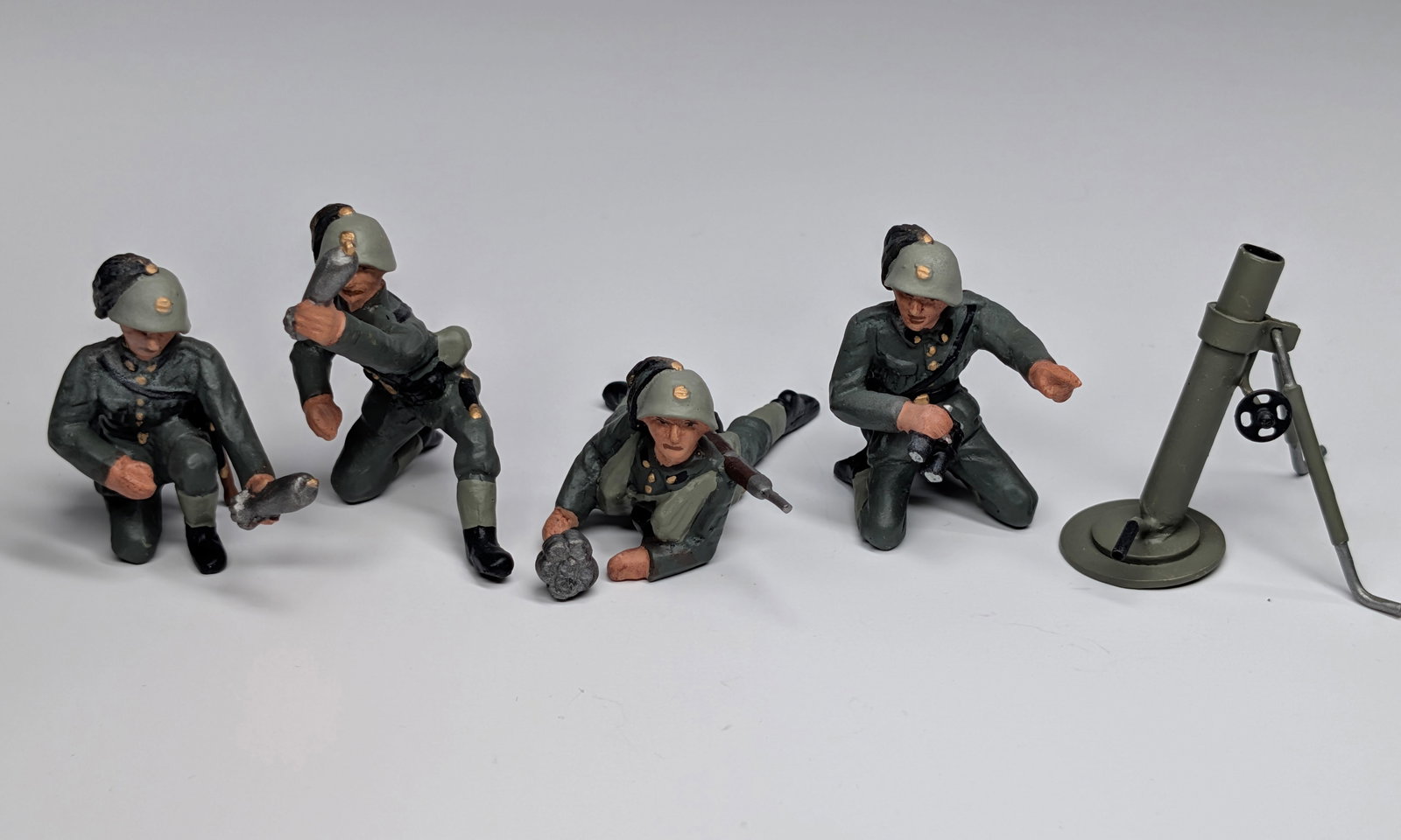 SET OF 5 HAND PAINTED "RK" LEAD SOLDIERS: ALL REMAIN IN VERY GOOD CONDITION.