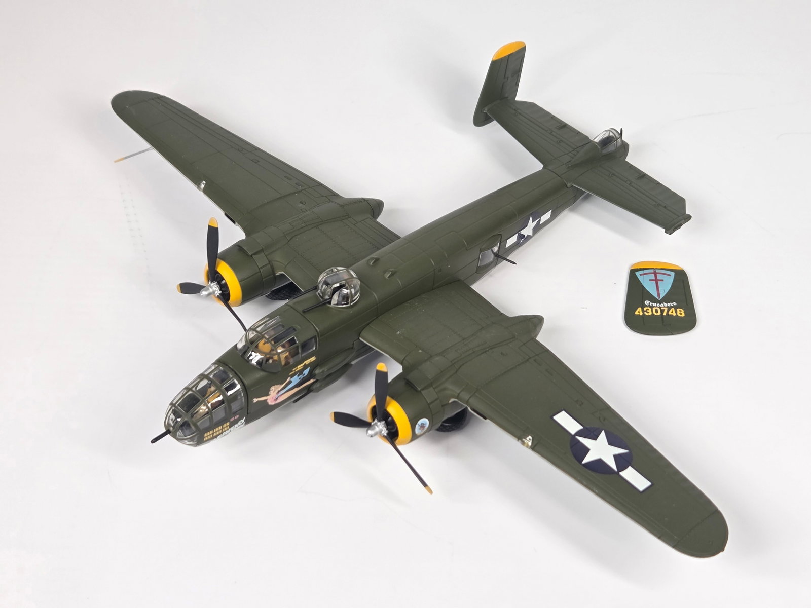 CORGI DIECAST B 25 AIRPLANE: REMAINS IN GOOD CONDITION, SHOWING SOME TYPICAL DISPLAY WEAR. ONE OF THE REAR WING PIECES IS BROKEN OFF.