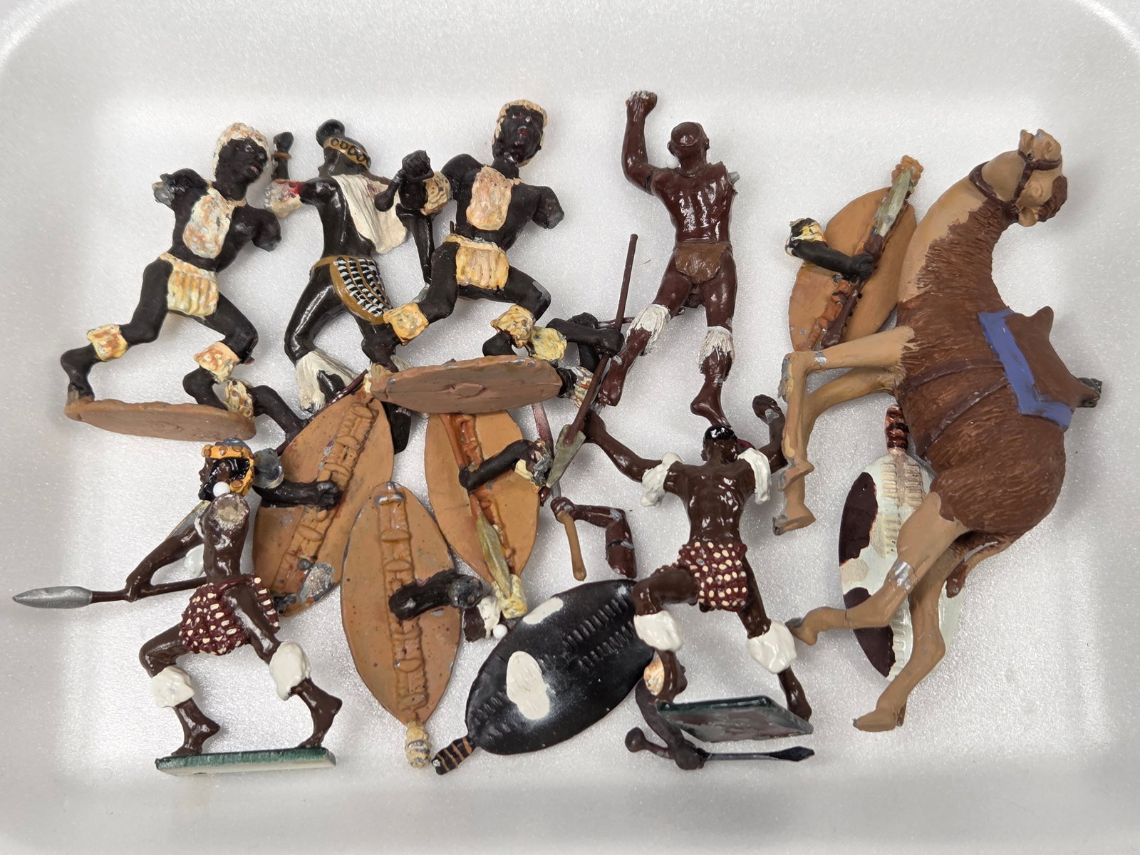 VARIOUS UNMARKED HAND PAINTED ZULU WARRIORS: ALL REMAIN IN POOR CONDITION, SHOWING BENDS OR BROKEN PIECES. PARTS LOT.