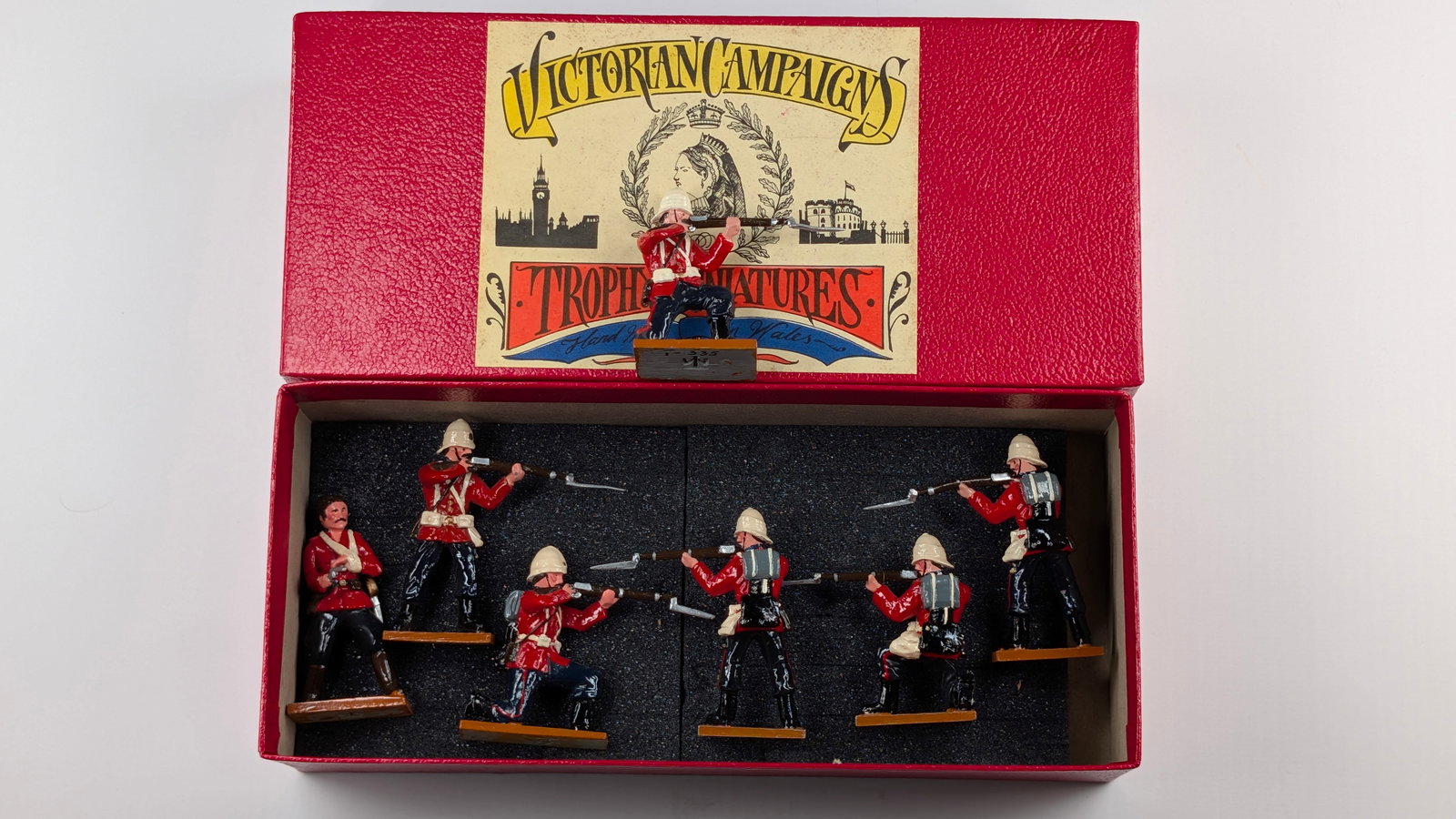 TROPHY MINIATURES SET OF 7 SOLDIER FIRING: REMAINS IN VERY GOOD CONDITION WITH BOX.