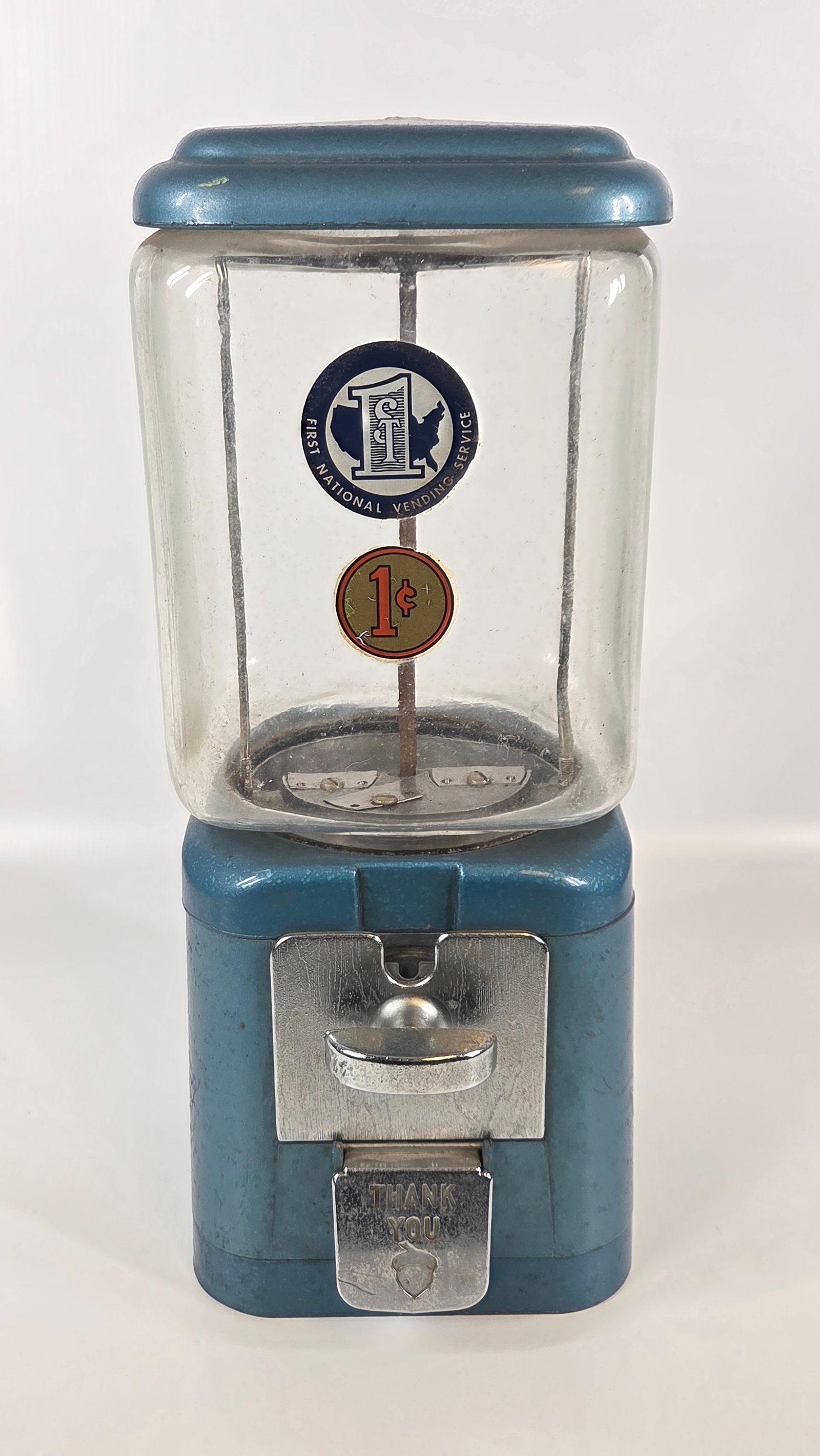 VINTAGE OAK 1 CENT GUMBALL VENDING MACHINE: REMAINS IN FAIR TO GOOD CONDITION, SHOWING TYPICAL USAGE WEAR.