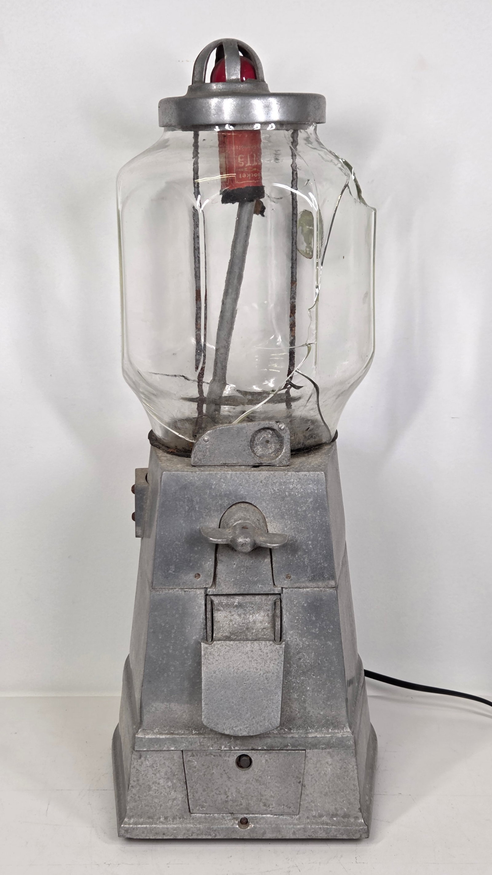ANTIQUE ROASTED HOT PEANUT MACHINE: REMAINS IN FAIR TO GOOD CONDITION, SHOWING TYPICAL USAGE WEAR THROUGHOUT. ORIGINAL GLASS IS CRACKED WITH SECTION BROKEN OUT AND MISSING. UNTESTED. NEEDS SOME WORK.