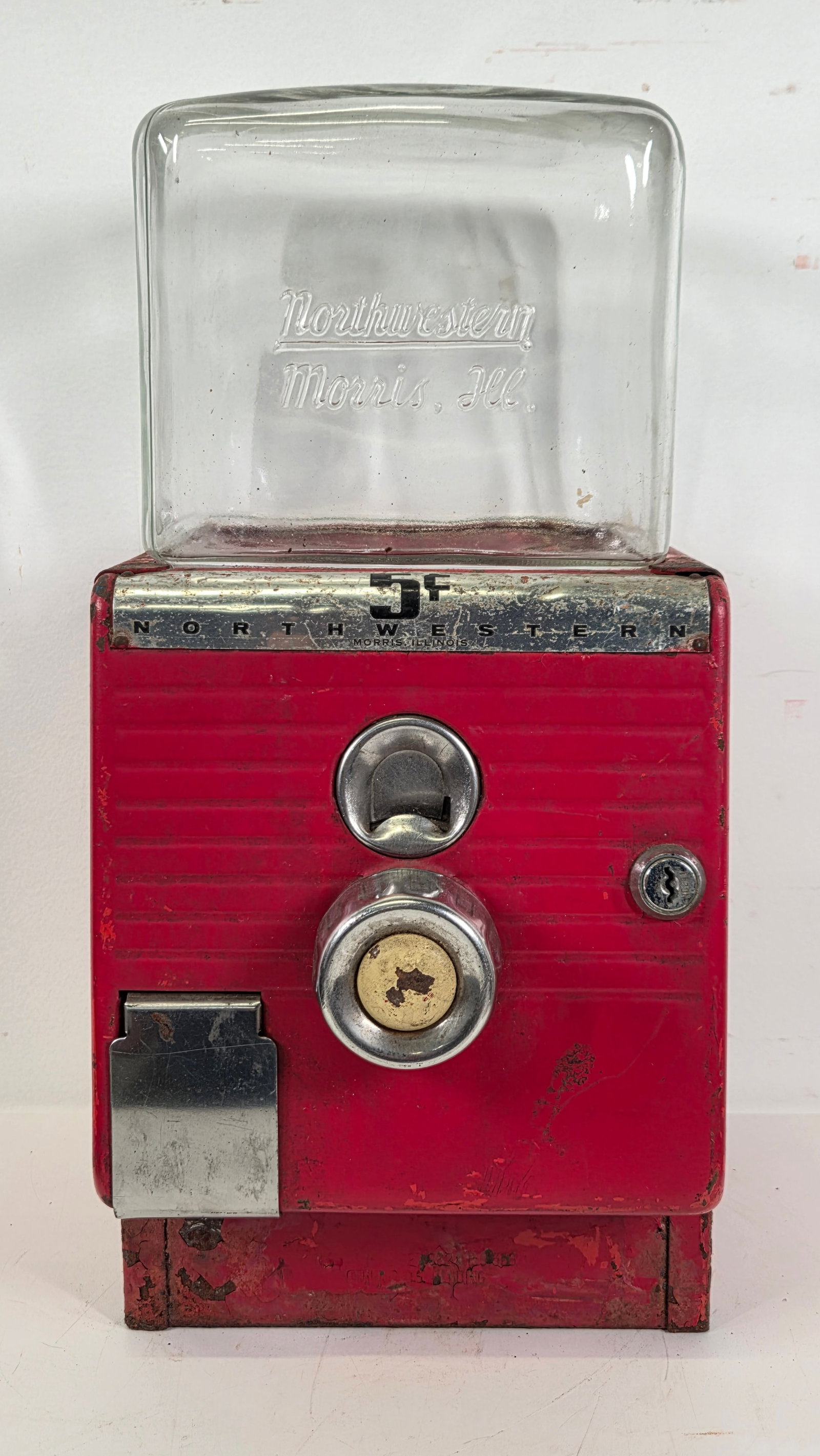 VINTAGE NORTHWESTERN 5 CENT VENDING MACHINE: REMAINS IN FAIR TO GOOD CONDITION, SHOWING USAGE WEAR WITH SCRATCHES.