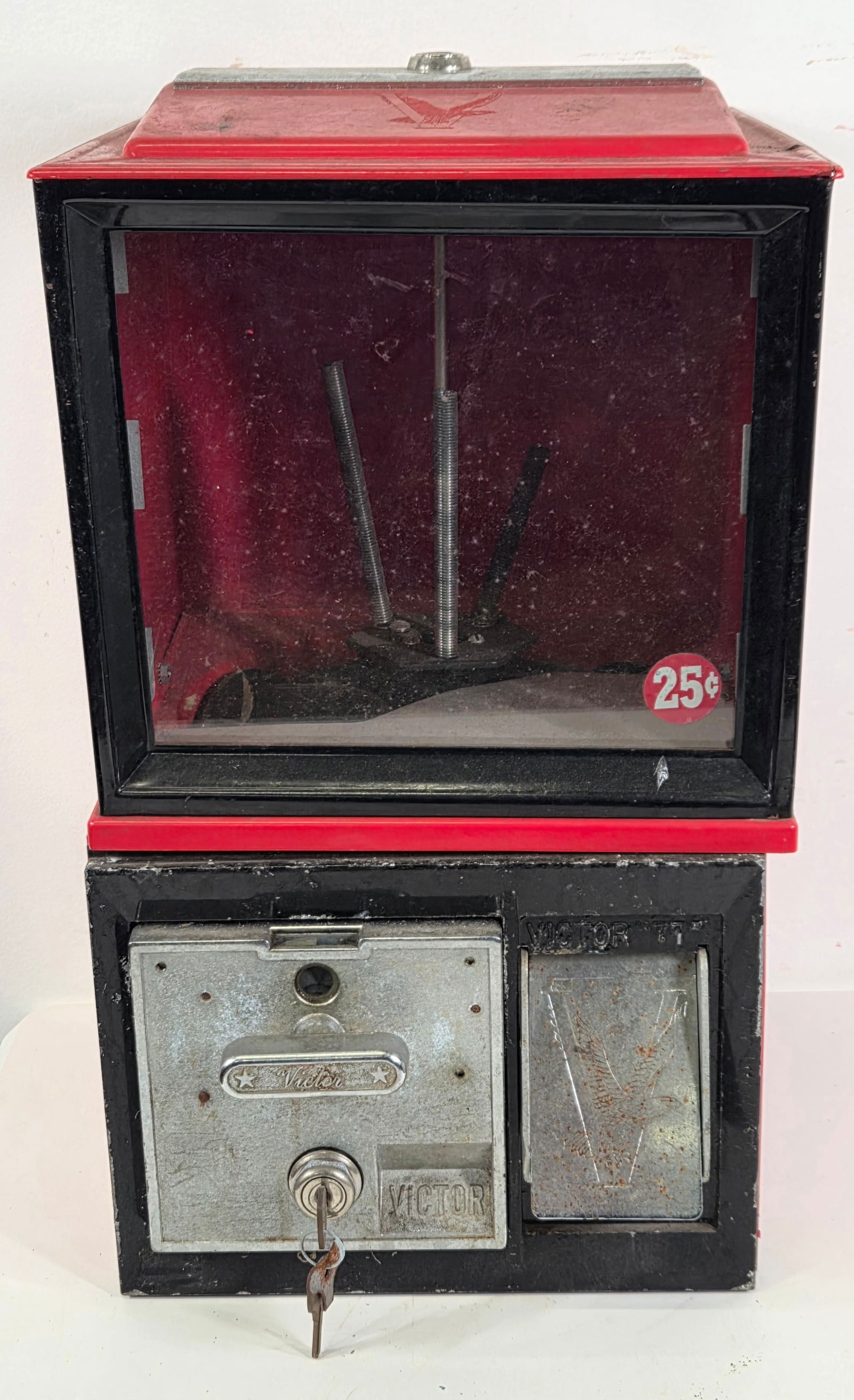VICTOR "77" GUMBALL VENDING MACHINE: REMAINS IN FAIR TO GOOD CONDITION, SHOWING TYPICAL USAGE WEAR THROUGHOUT.