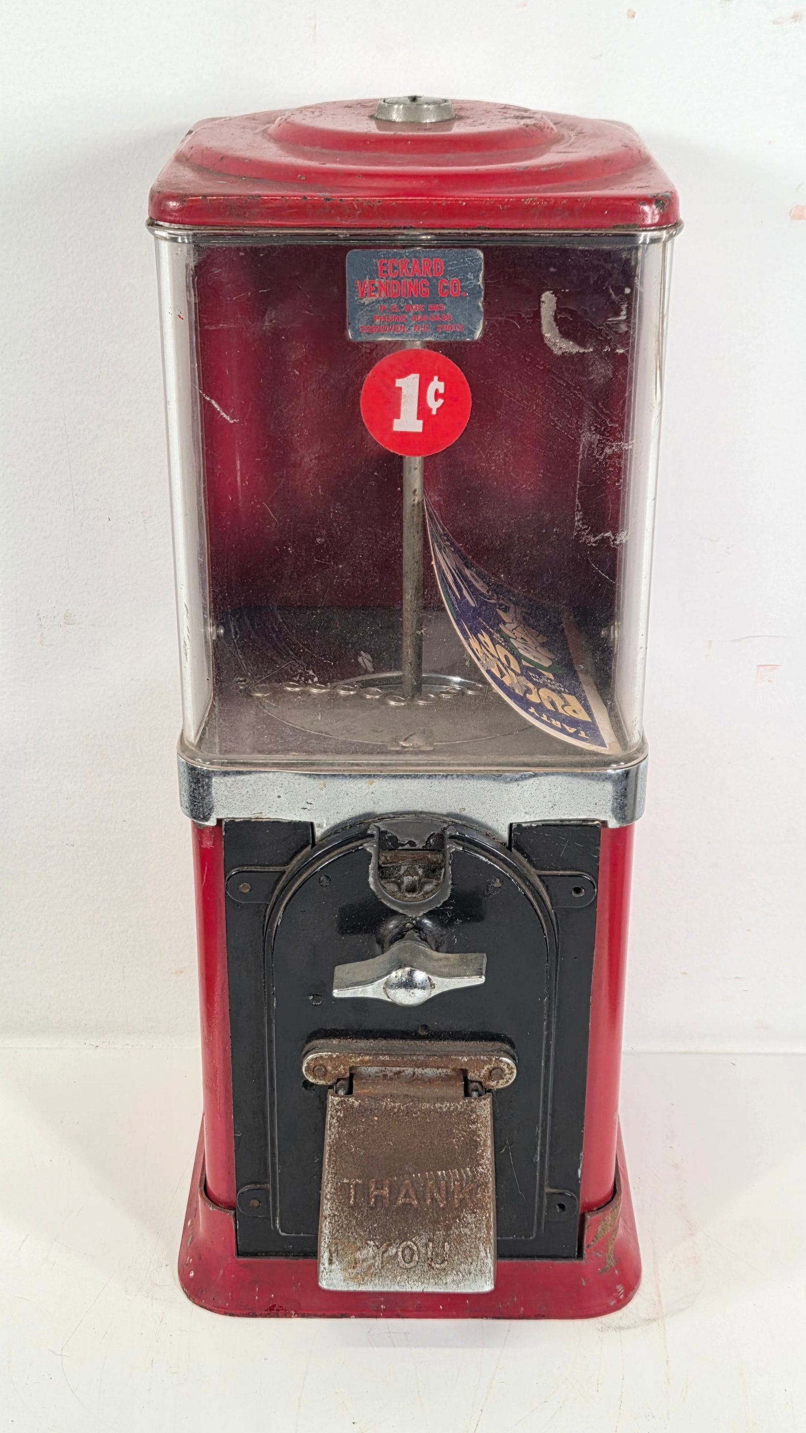 VINTAGE ECKARD 1 CENT VENDING MACHINE: REMAINS IN FAIR TO GOOD CONDITION, SHOWING TYPICAL USAGE WEAR THROUGHOUT.