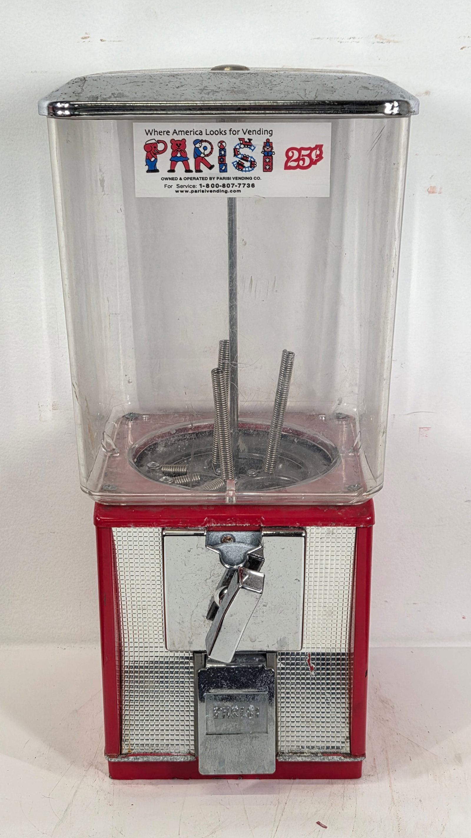 PARISI 25 CENT GUMBALL VENDING MACHINE: REMAINS IN GOOD CONDITION, SHOWING SOME WEAR TO LABEL.