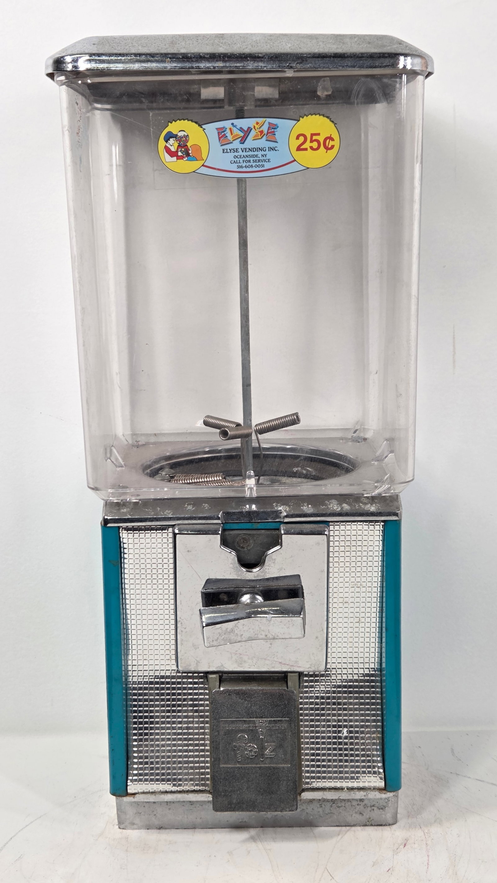 VINTAGE FOLZ ELYSE VENDING INC. GUMBALL MACHINE: REMAINS IN GOOD CONDITION, SHOWING SOME TYPICAL WEAR.