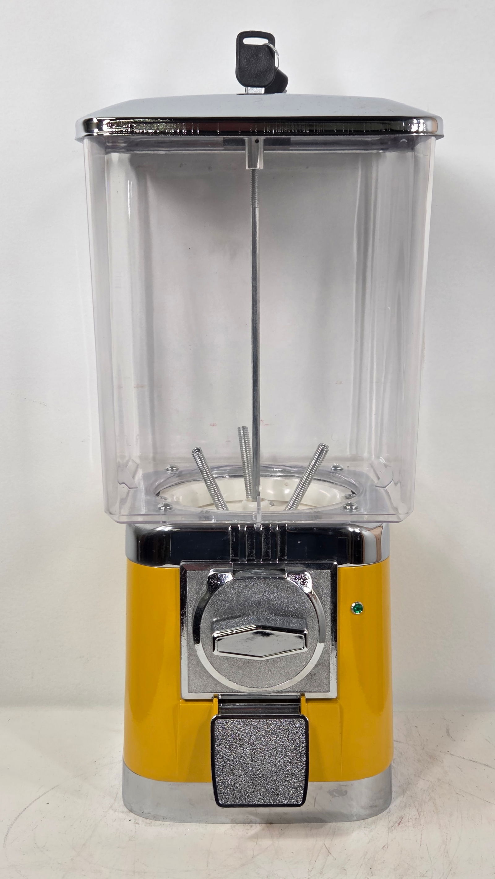 VINTAGE YELLOW & CHROME GUMBALL VENDING MACHINE: REMAINS IN VERY GOOD UNUSED CONDITION.