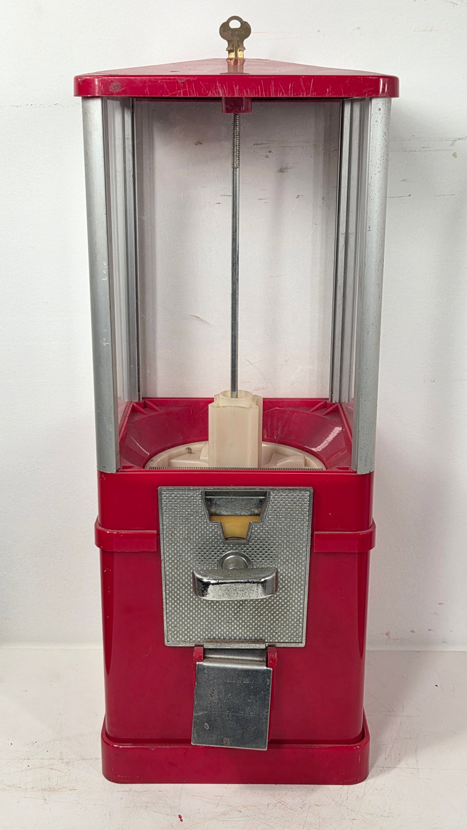 VINTAGE PLASTIC GUMBALL VENDING MACHINE: REMAINS IN GOOD CONDITION, SHOWING SOME TYPICAL USAGE WEAR.