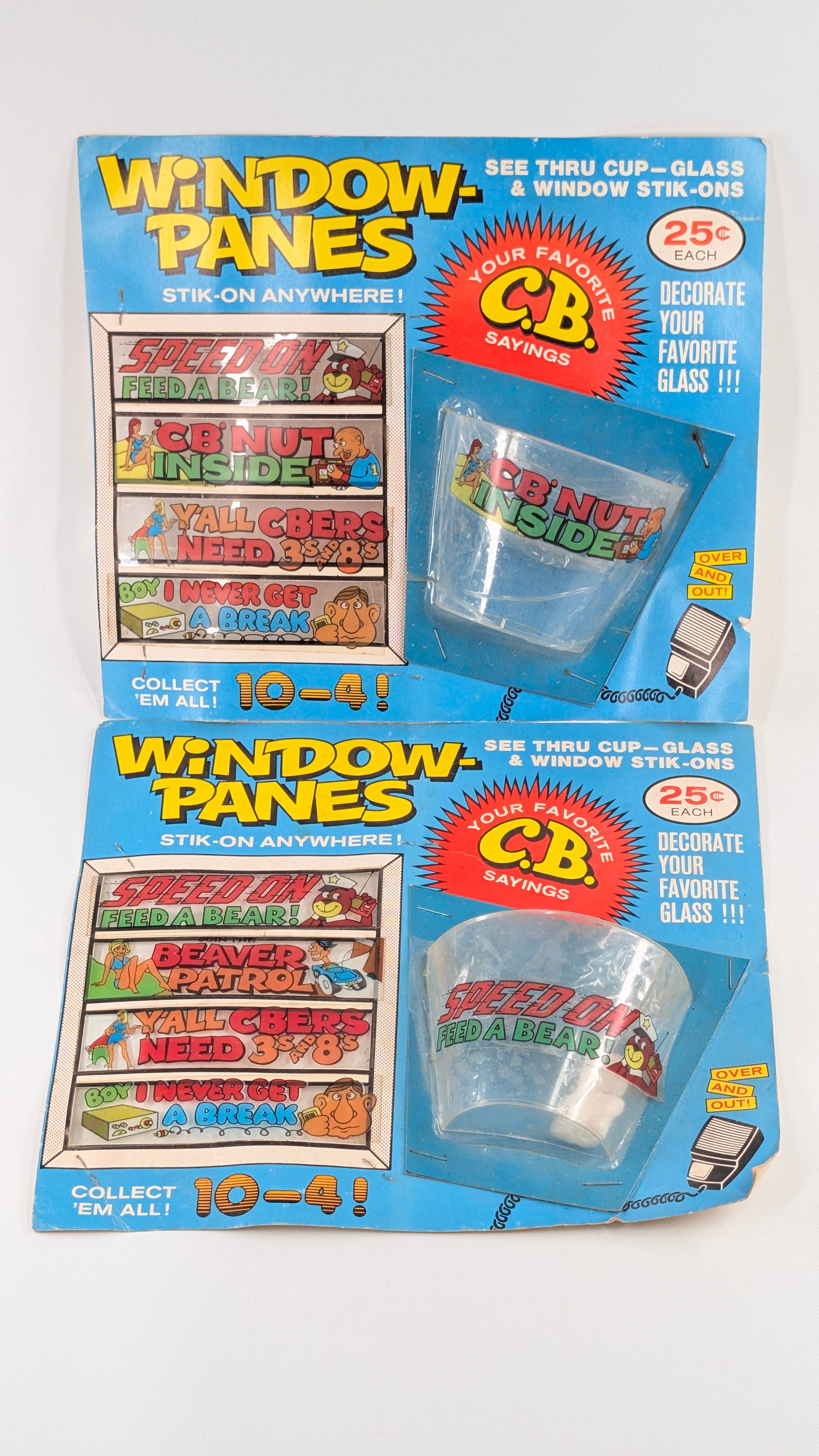 2) C.B. SAYINGS WINDOW PANES STICK ON DISPLAYS: BOTH REMAIN IN GOOD CONDITION, SHOWING SOME TYPICAL WEAR.