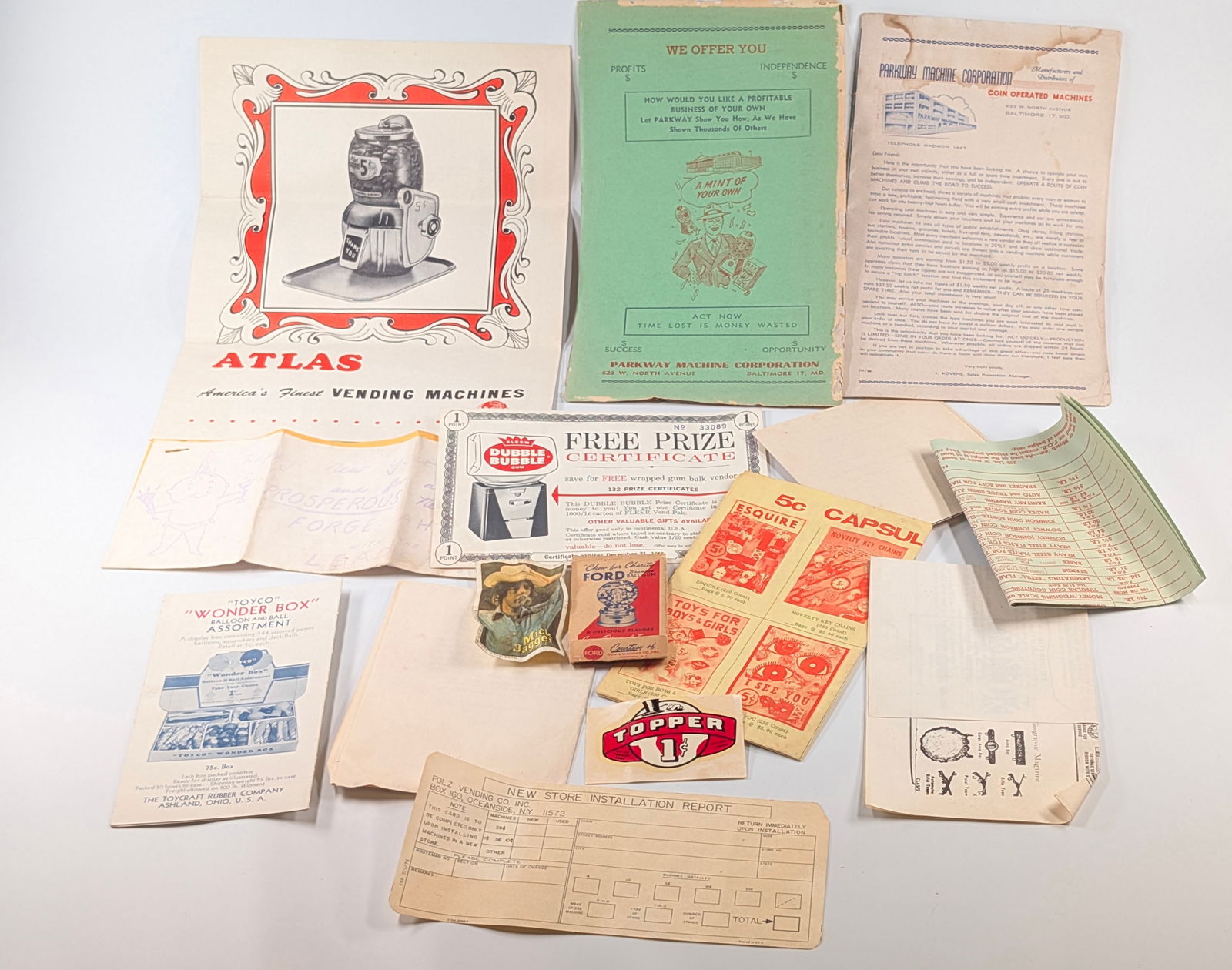 VARIOUS ANTIQUE VENDING MACHINE EPHEMERA: ALL REMAIN IN GOOD CONDITION, SHOWING SOME TYPICAL WEAR.