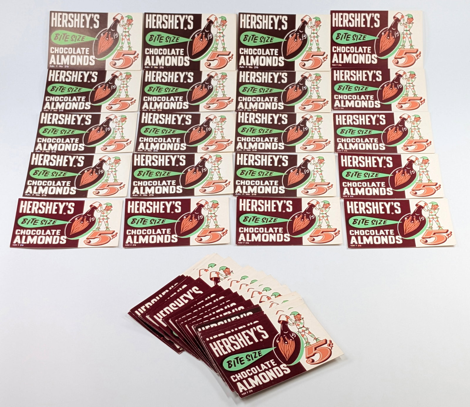 MANY VINTAGE HERSHEY'S CHOCOLATE ALMONDS SIGNS: ALL REMAIN IN GOOD CONDITION.