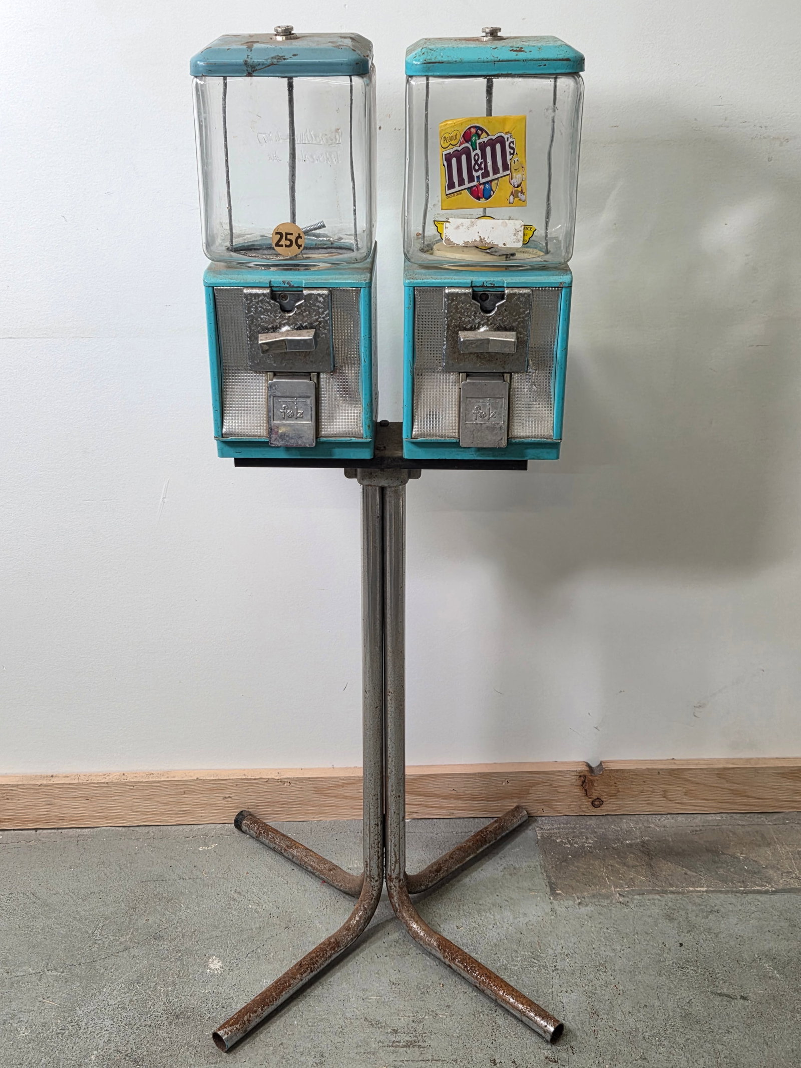 PAIR OF VINTAGE FOLZ LT BLUE VENDING MACHINES ON STAND: REMAINS IN FAIR TO GOOD CONDITION, SHOWING USAGE WEAR THROUGHOUT. **PLEASE NOTE** THIS ITEM IS NOT AVAILABLE FOR SHIPPING. LOCAL PICKUP ONLY PLEASE.