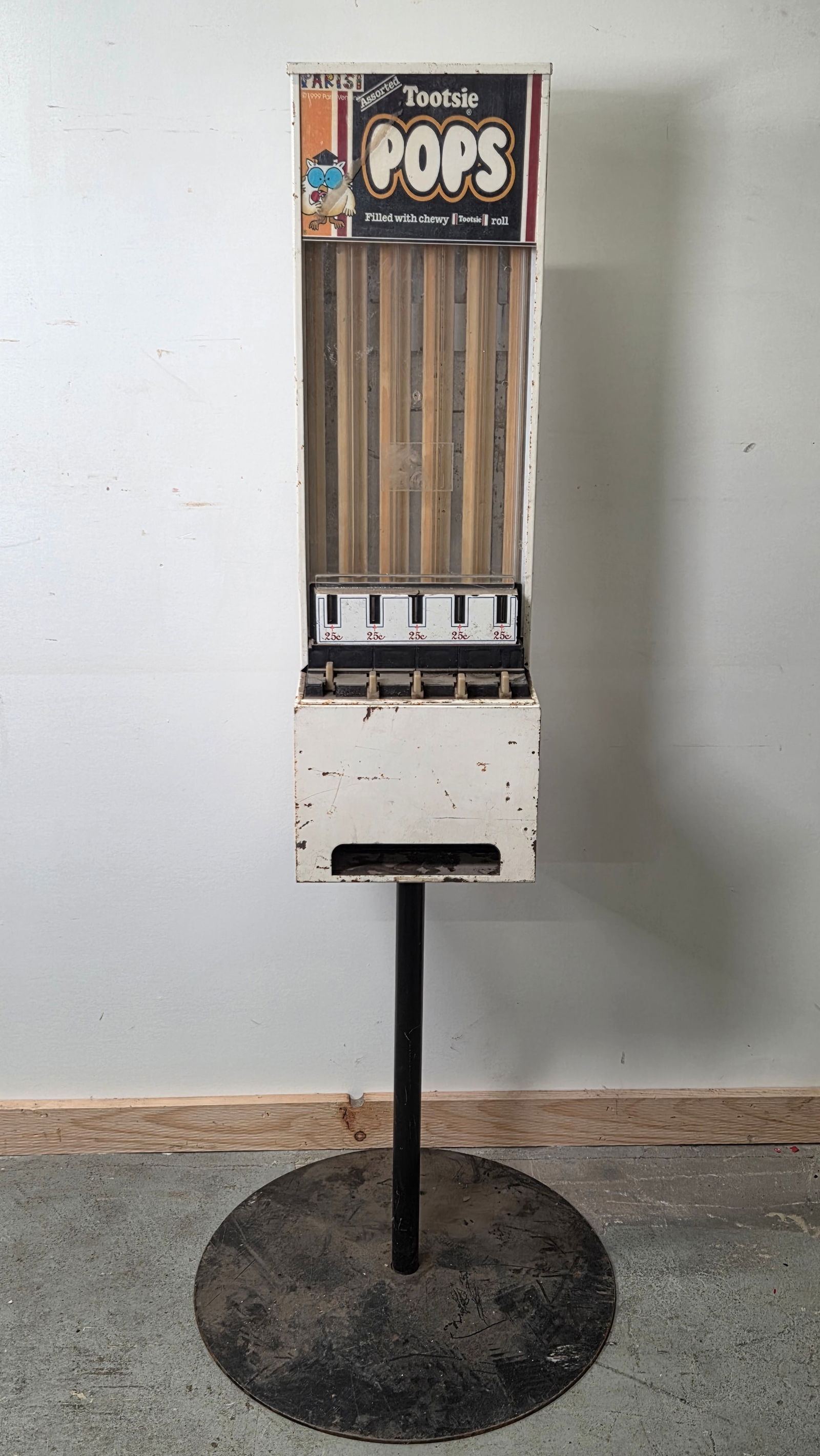 VINTAGE PARISI TOOTSIE POPS VENDING MACHINE: REMAINS IN FAIR CONDITION, SHOWING USAGE / STORAGE WEAR THROUGHOUT. UNTESTED. **PLEASE NOTE** THIS ITEM IS NOT AVAILABLE FOR SHIPPING. LOCAL PICKUP ONLY PLEASE.