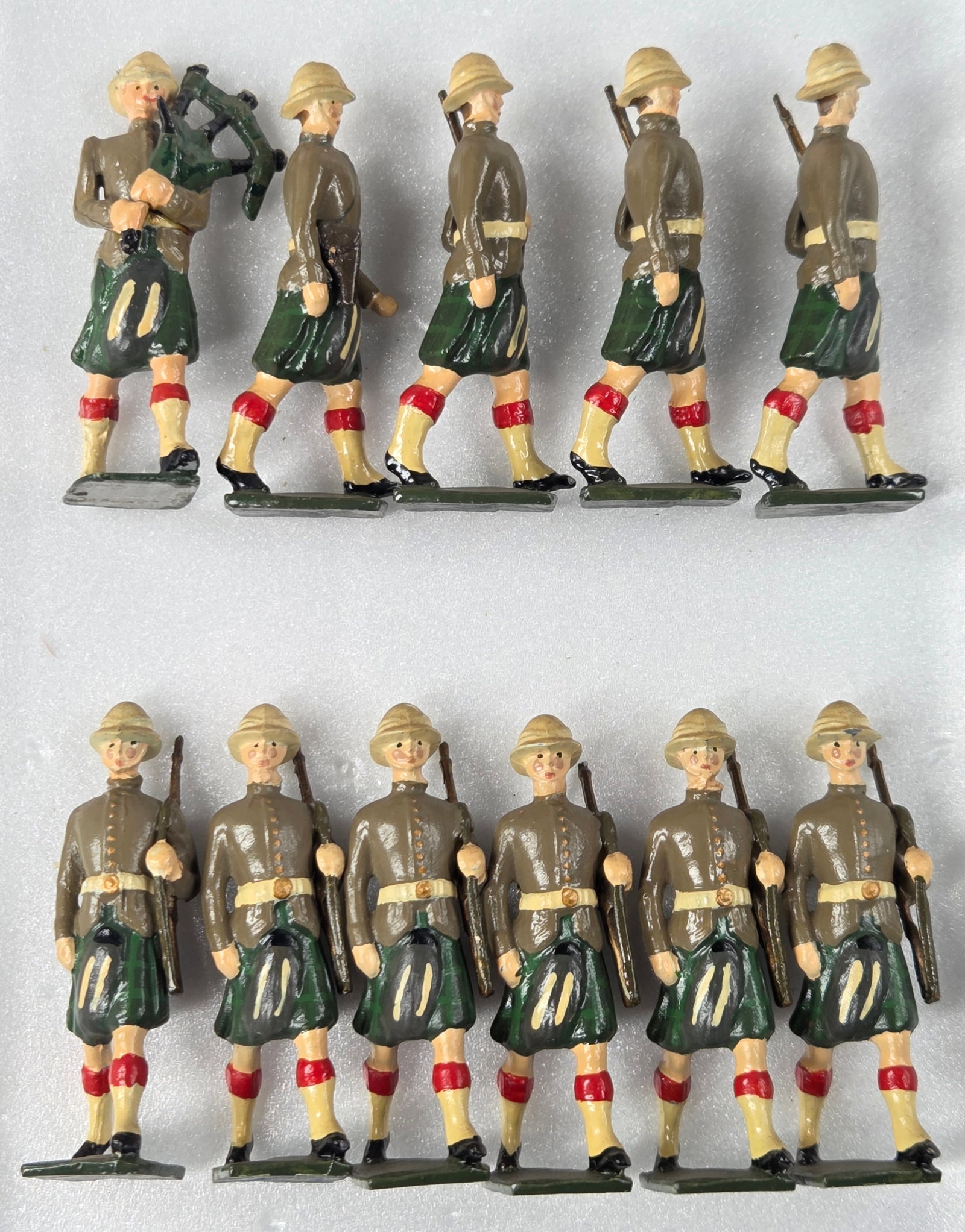 11) UNMARKED HAND PAINTED HIGHLANDERS: ALL REMAIN IN GOOD CONDITION, SHOWING SOME TYPICAL WEAR.