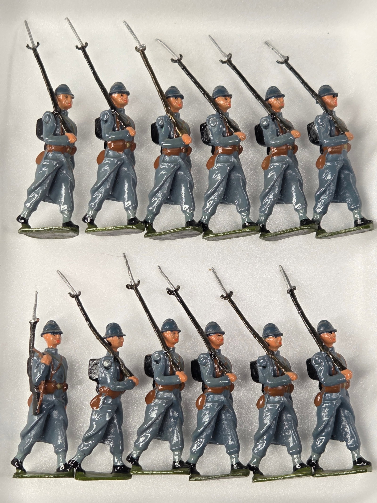 12) UNMARKED FRENCH INFANTRY SOLDIERS: ALL REMAIN IN GOOD CONDITION, SHOWING SOME TYPICAL WEAR.