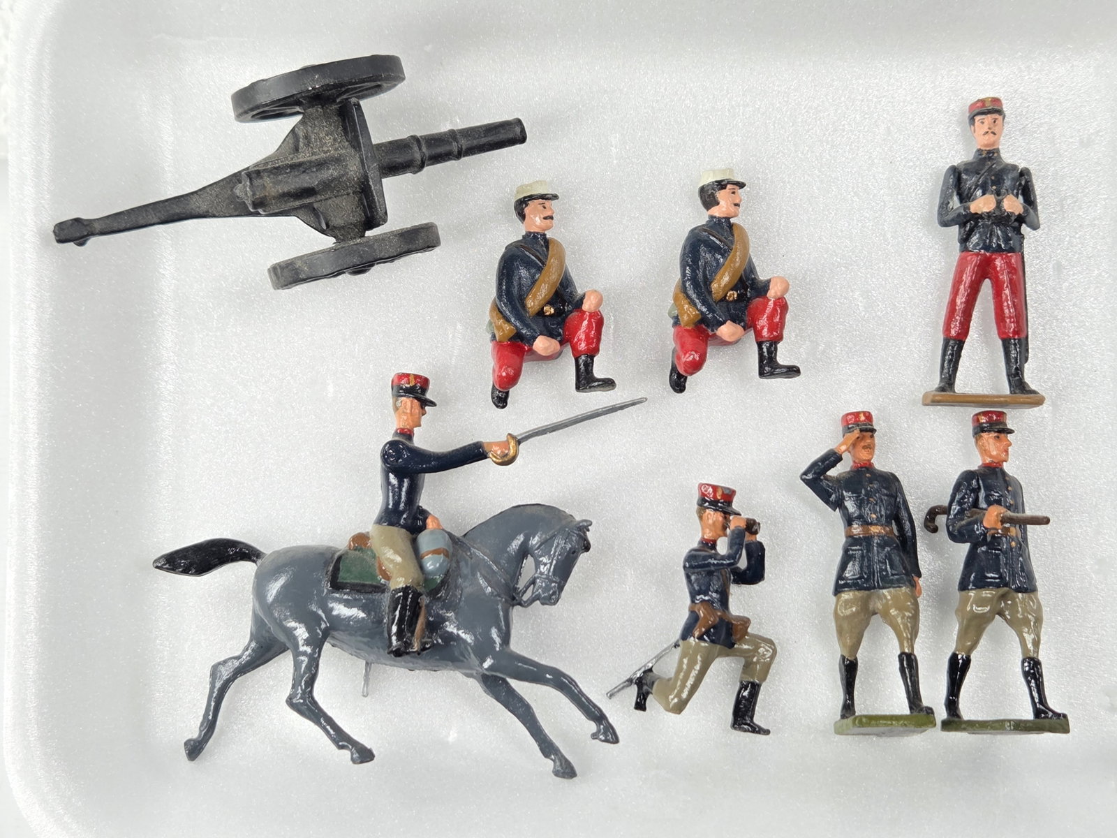 7) VARIOUS BRAND LEAD SOLDIERS W/ CANNON: ALL REMAIN IN GOOD CONDITION, SHOWING SOME TYPICAL WEAR.