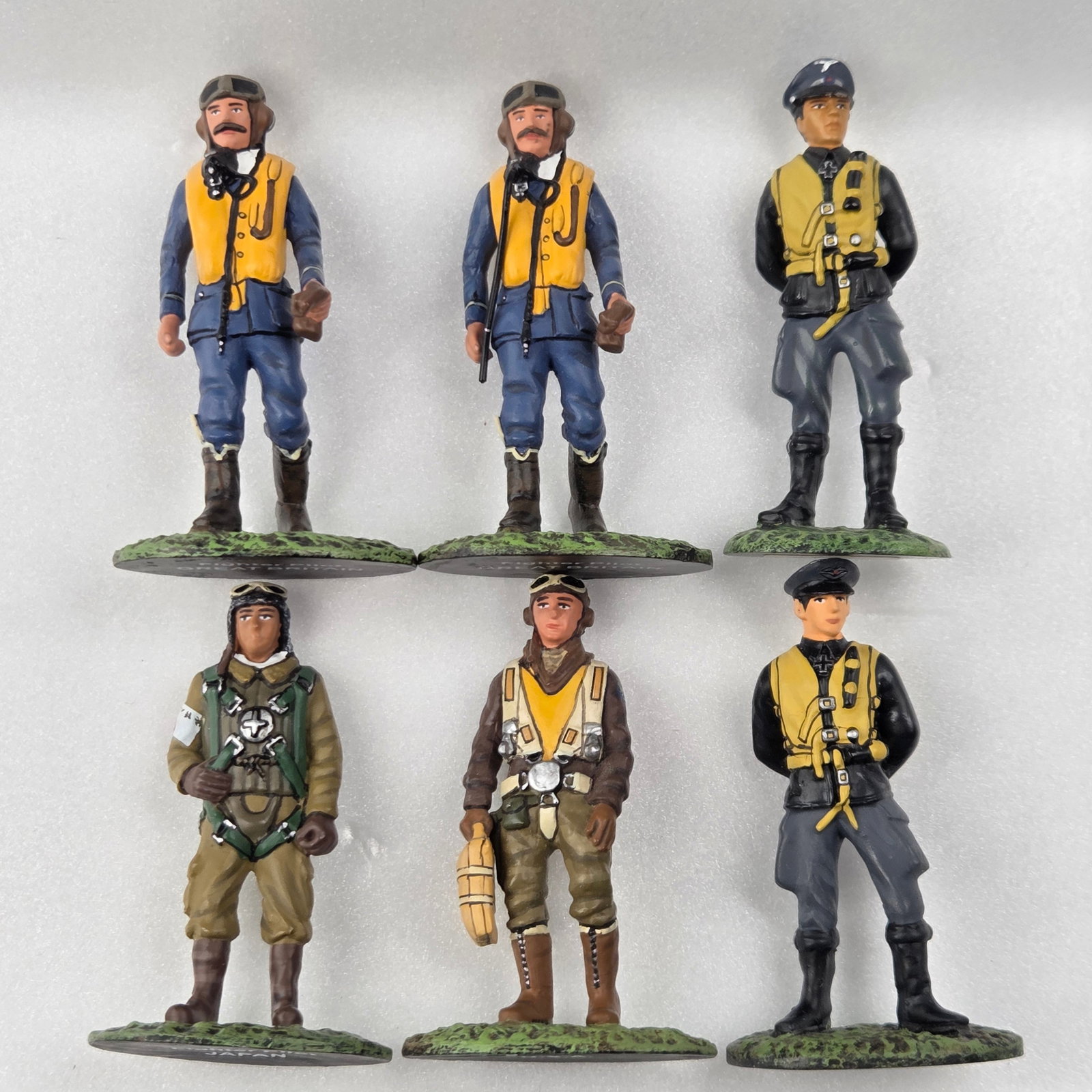 6) HAND PAINTED WWII SOLDIERS: ALL REMAIN IN GOOD CONDITION, SHOWING SOME TYPICAL WEAR.