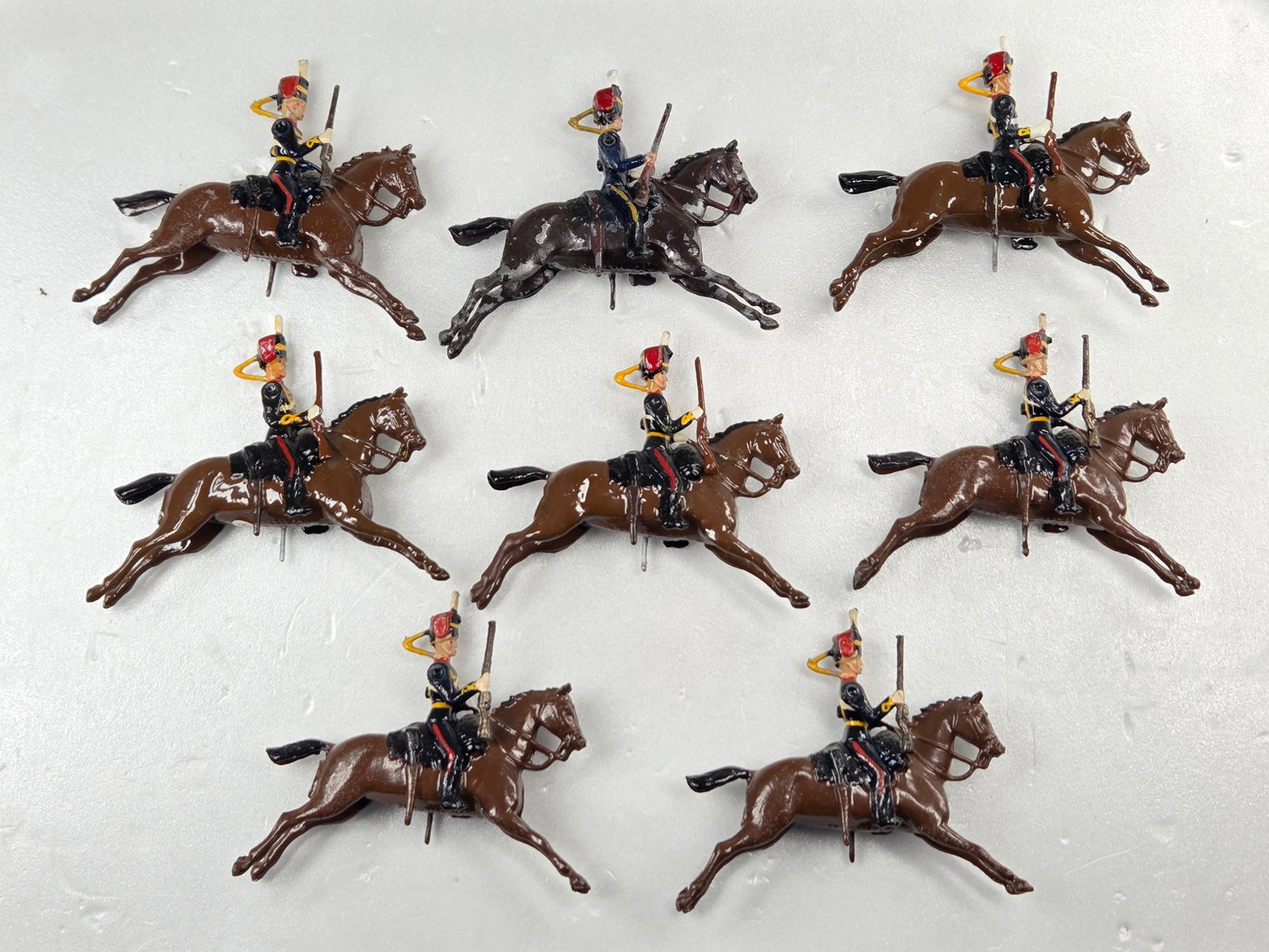 SET OF 8 VINTAGE BRITAIN 11TH HUSSARS MOUNTED: ALL REMAIN IN FAIR TO GOOD CONDITION, SHOWING SOME PAINT WEAR AND SOME LOOSE ARMS.