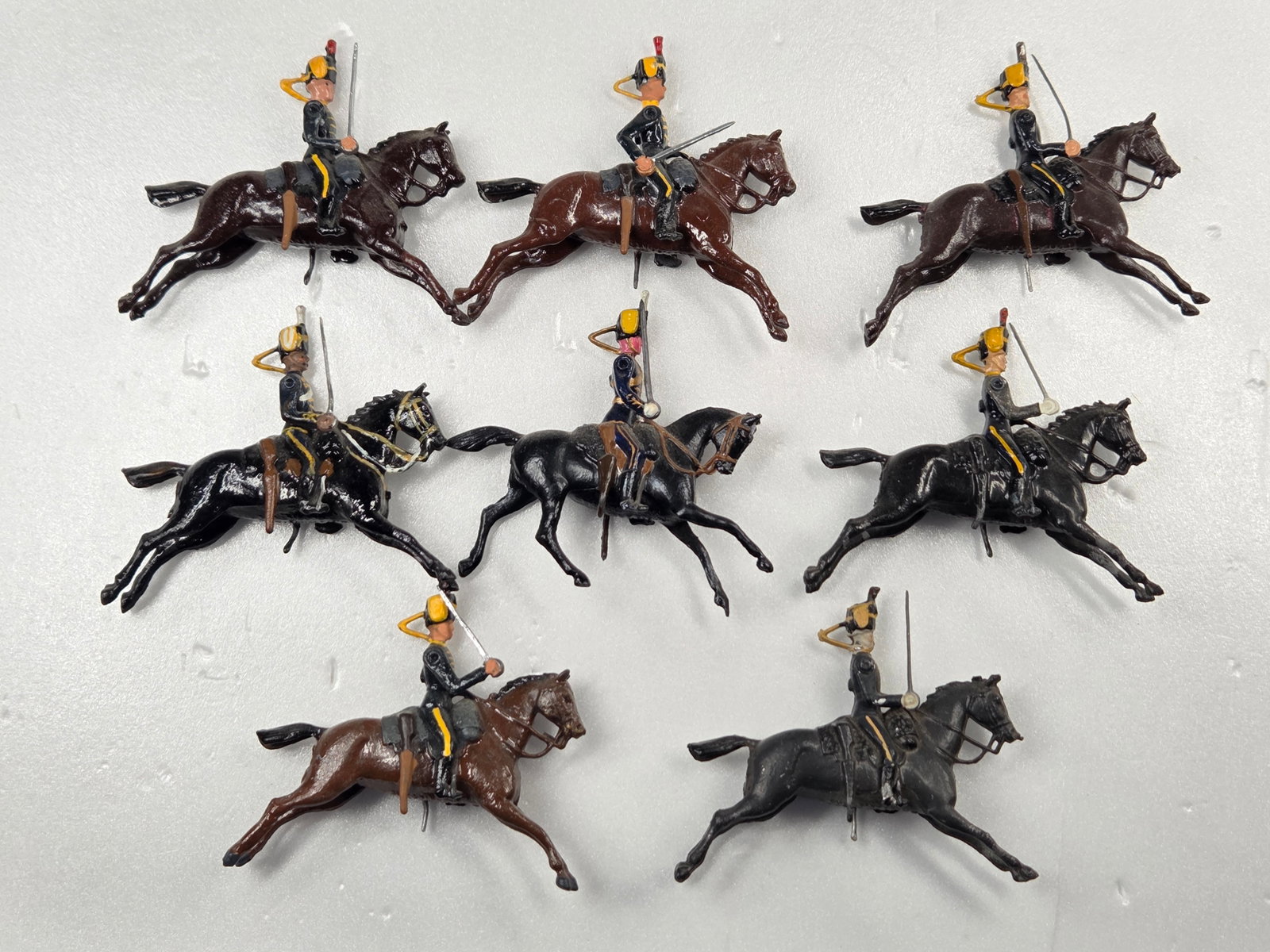 SET OF 8 VINTAGE BRITAIN 11TH HUSSARS MOUNTED: ALL REMAIN IN FAIR TO GOOD CONDITION, SHOWING SOME PAINT WEAR AND SOME LOOSE ARMS.