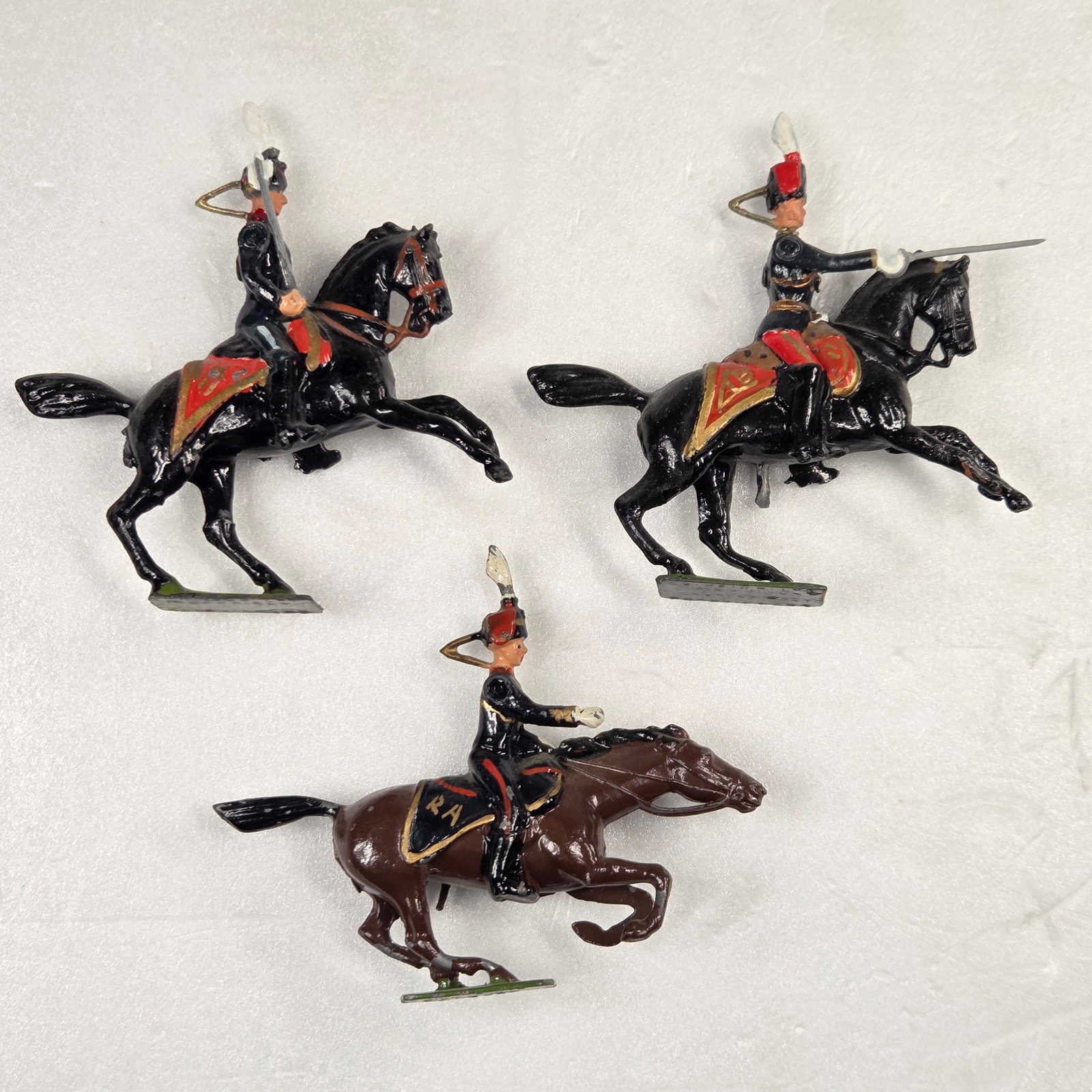 SET OF 3 VINTAGE BRITAIN 11TH HUSSARS MOUNTED REARING: ALL REMAIN IN FAIR TO GOOD CONDITION, SHOWING SOME PAINT WEAR AND SOME LOOSE ARMS.