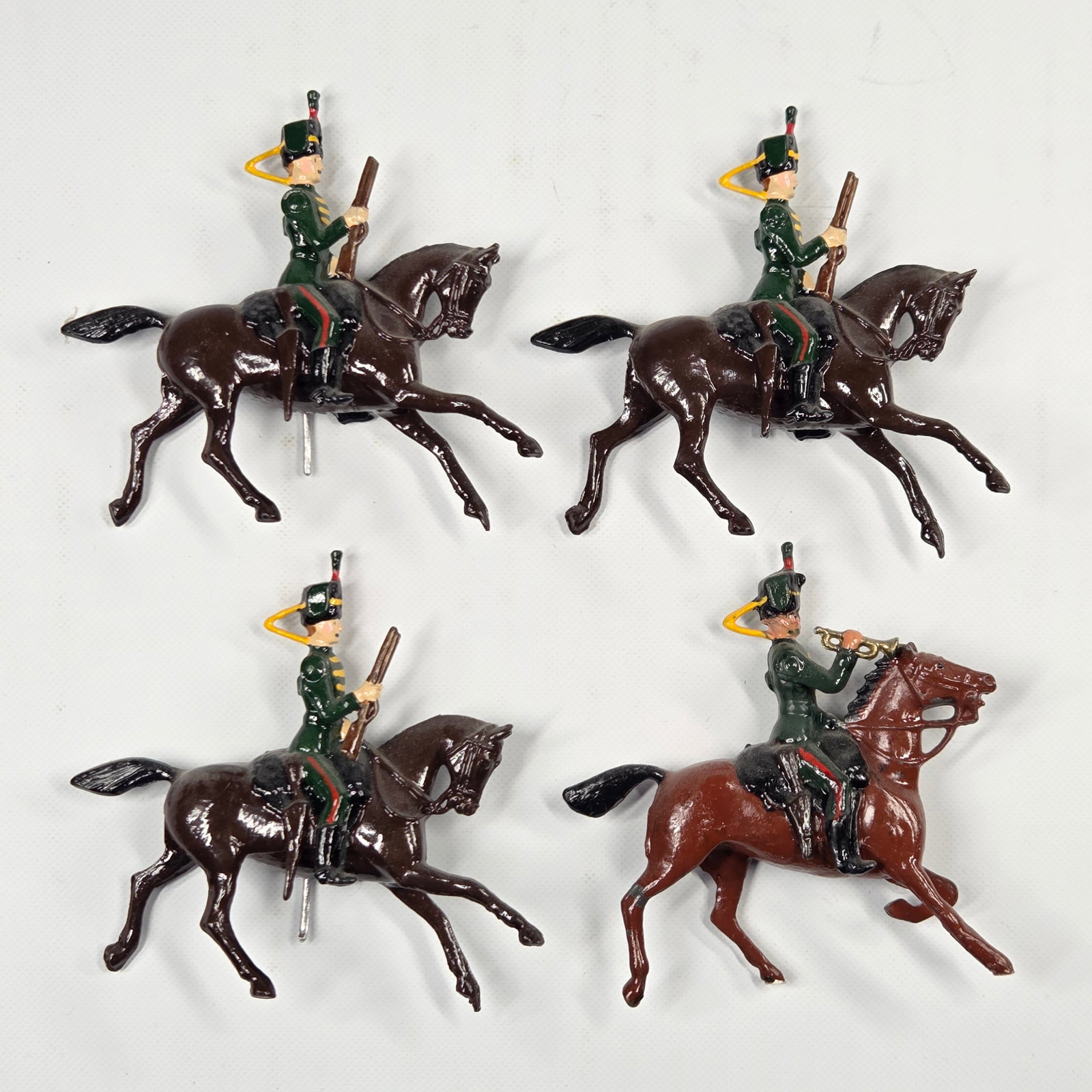 SET OF 4 VINTAGE BRITAIN 11TH HUSSARS MOUNTED: ALL REMAIN IN FAIR TO GOOD CONDITION, SHOWING SOME PAINT WEAR AND SOME LOOSE ARMS.