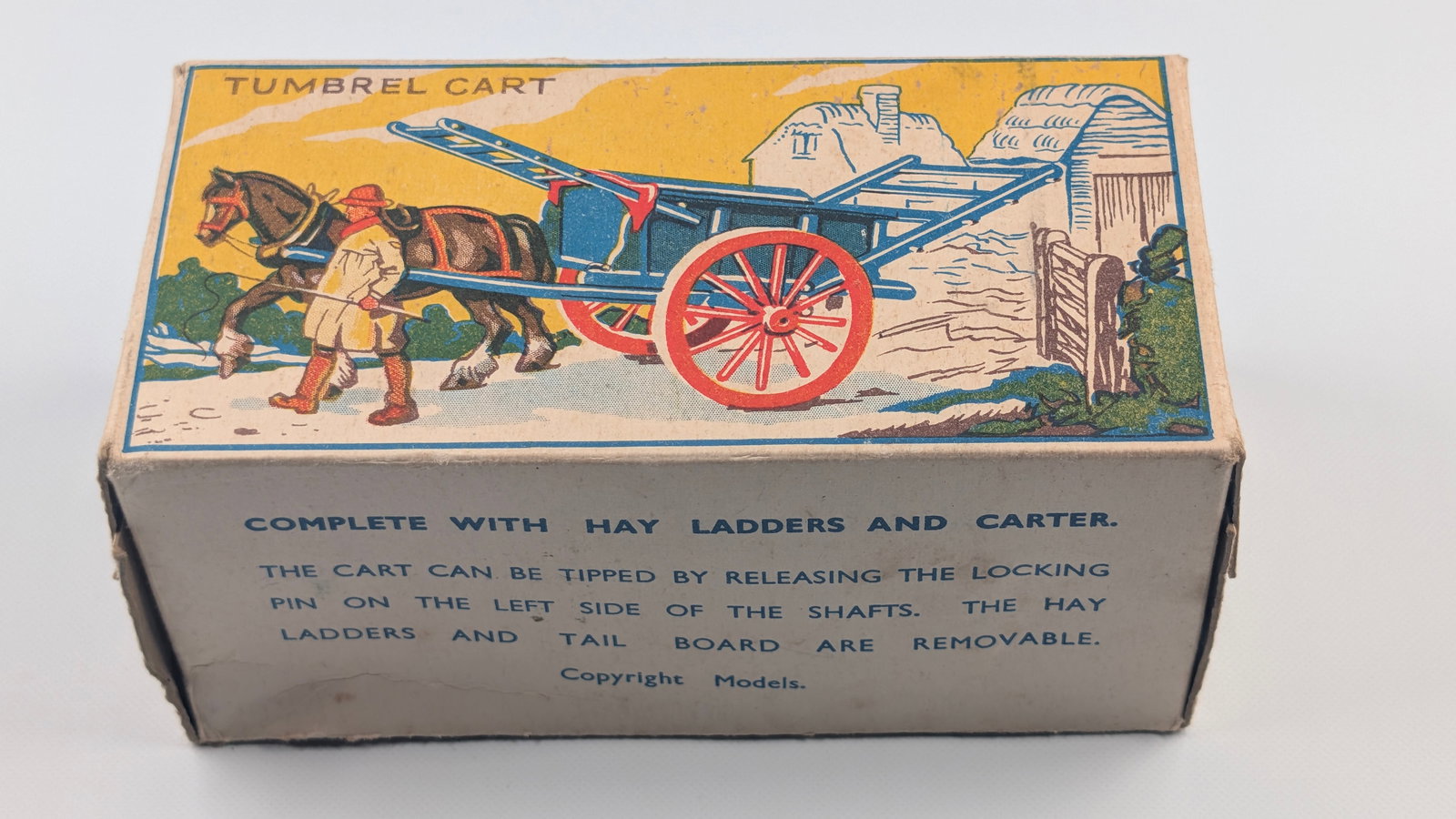 VINTAGE BRITAIN NO. 4F TUMBREL CART W/ BOX: REMAINS IN GOOD CONDITION. FARMER SHOWING SOME PAINT WEAR. BOX REMAINS NICE.