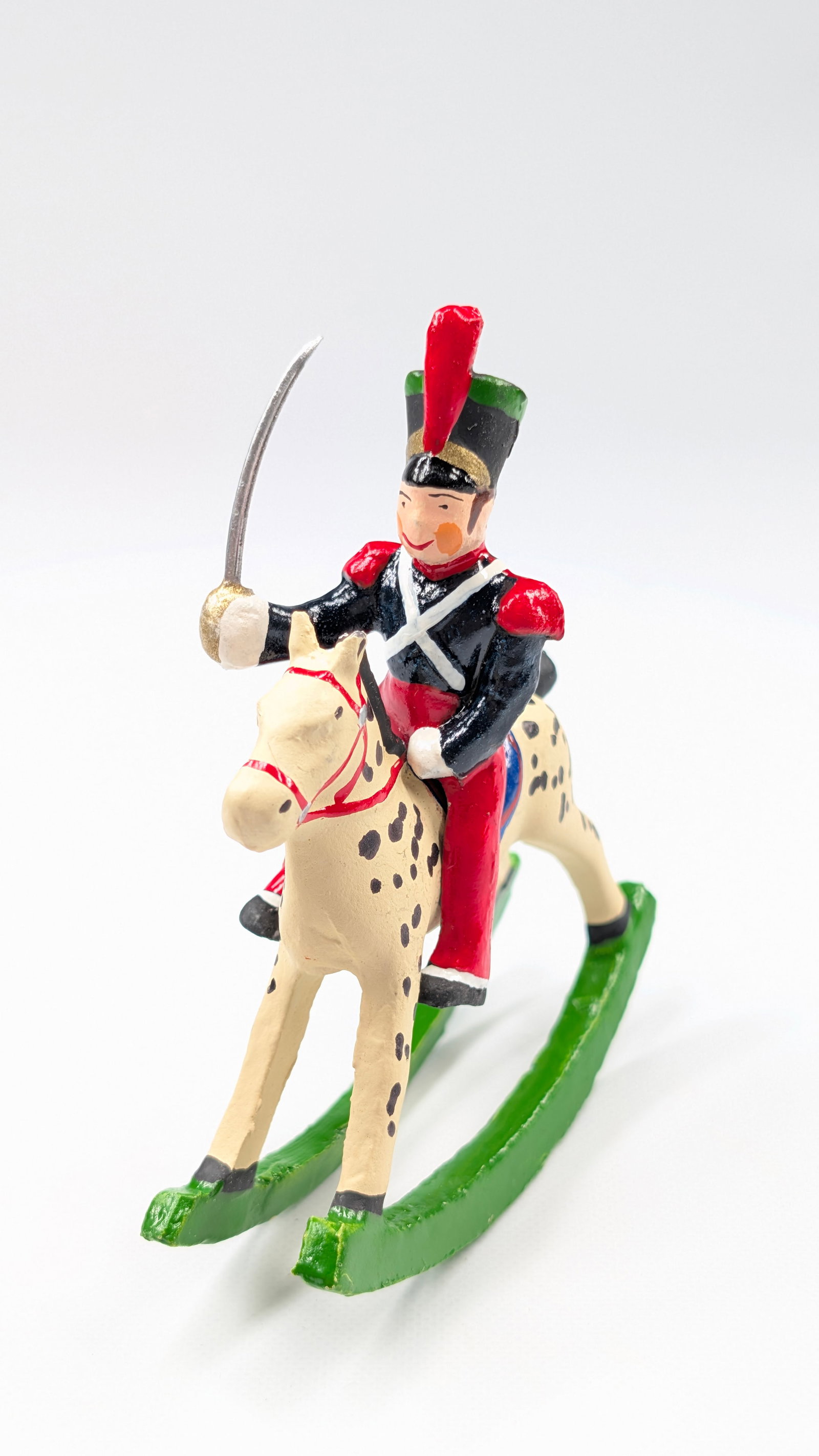 UNMARKED HAND PAINTED SOLDIER ROCKING HORSE: REMAINS IN GOOD CONDITION, SHOWING SOME LIGHT WEAR. SMALL BEND IN SWORD.