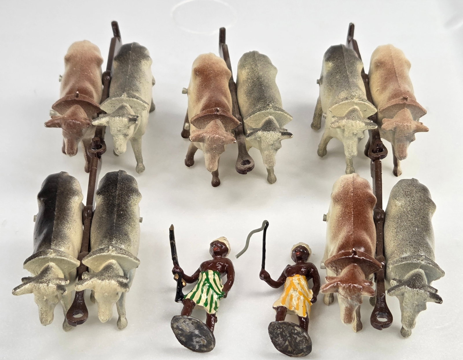 LEAD OX TEAM SETS W/ 2 LEAD NATIVES: ALL REMAIN IN GOOD CONDITION, SHOWING SOME TYPICAL WEAR.
