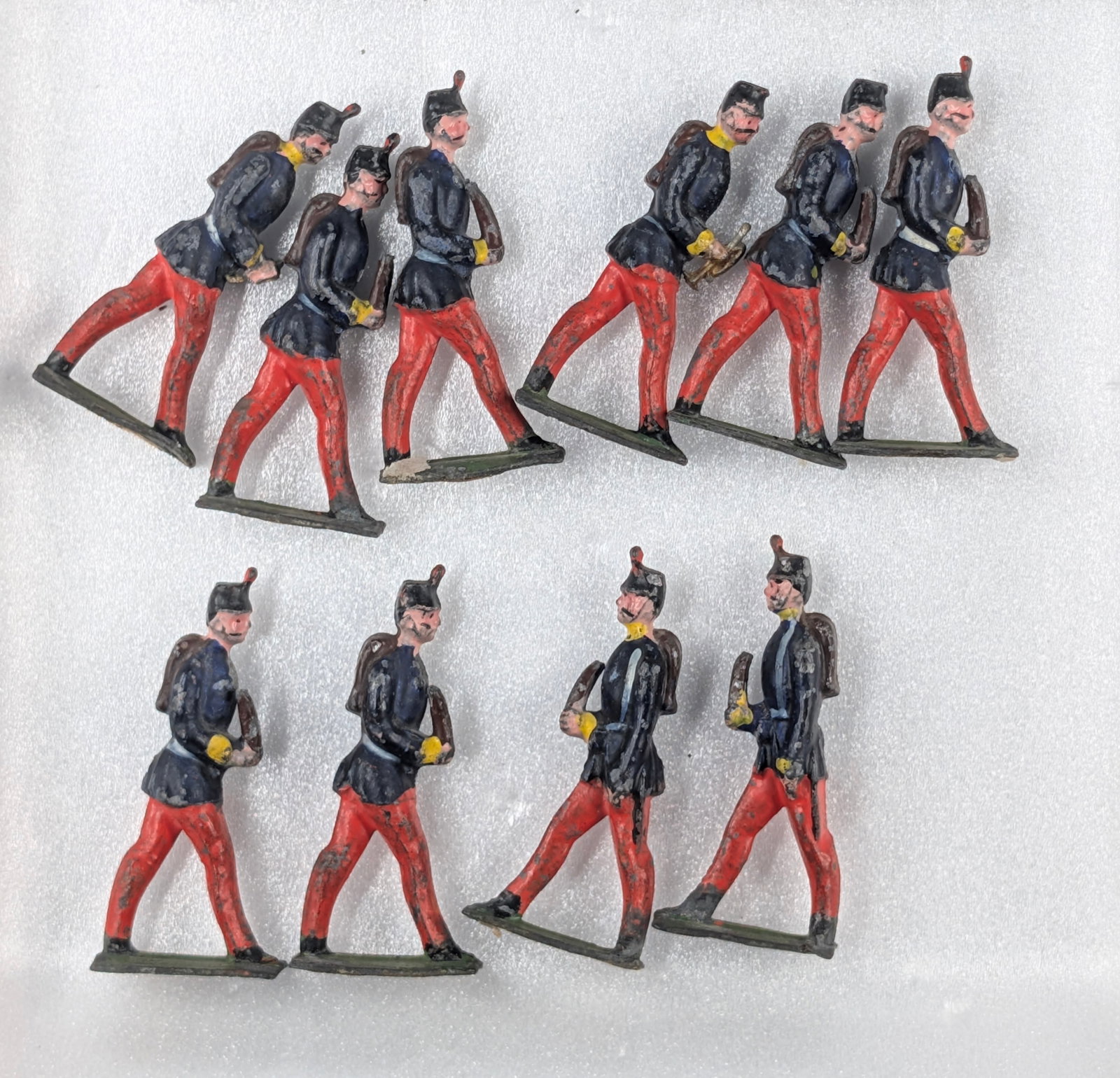 SET OF 10 HAND PAINTED EUROPEAN INFANTRY: ALL REMAIN IN FAIR CONDITION, SHOWING PAINT WEAR AND BROKEN PIECES.