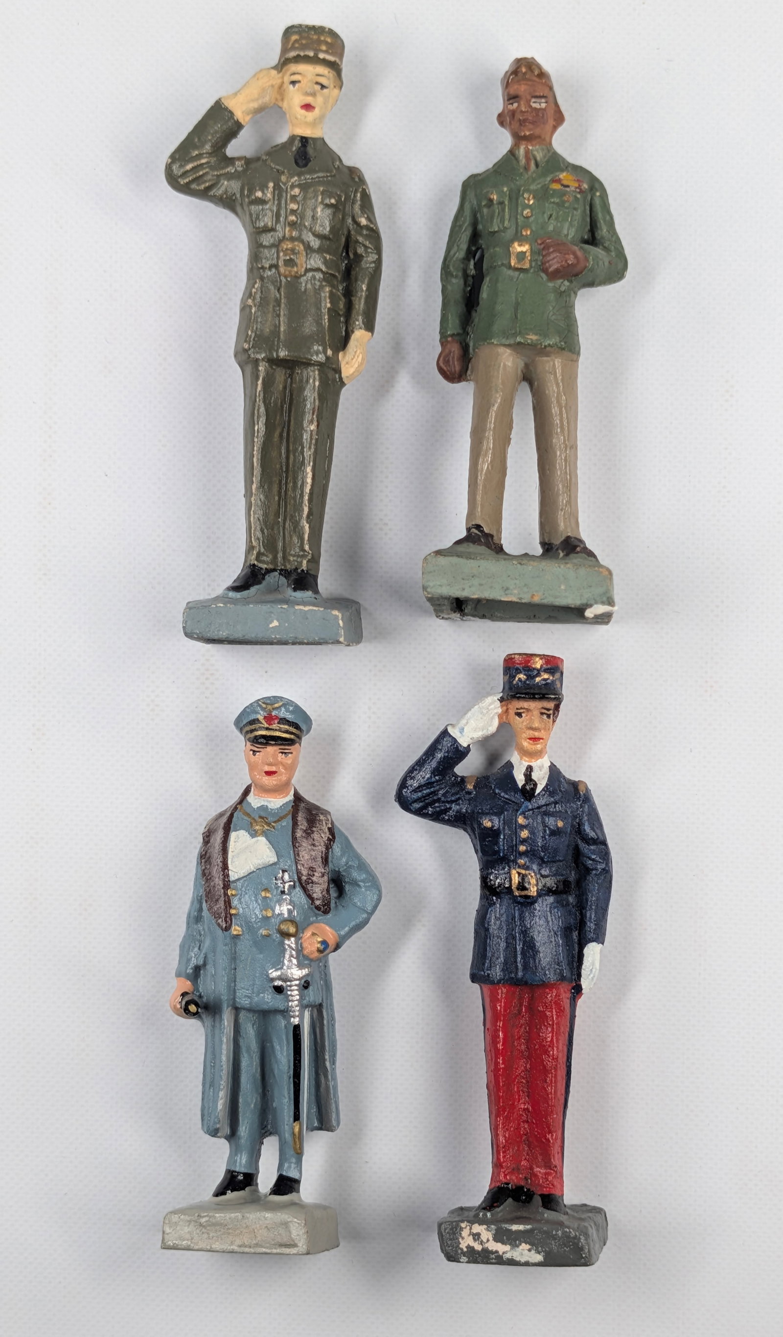4) CURSO COMPOSITION SOLDIERS: ALL REMAIN IN FAIR TO GOOD CONDITION, SHOWING SOME TYPICAL WEAR.