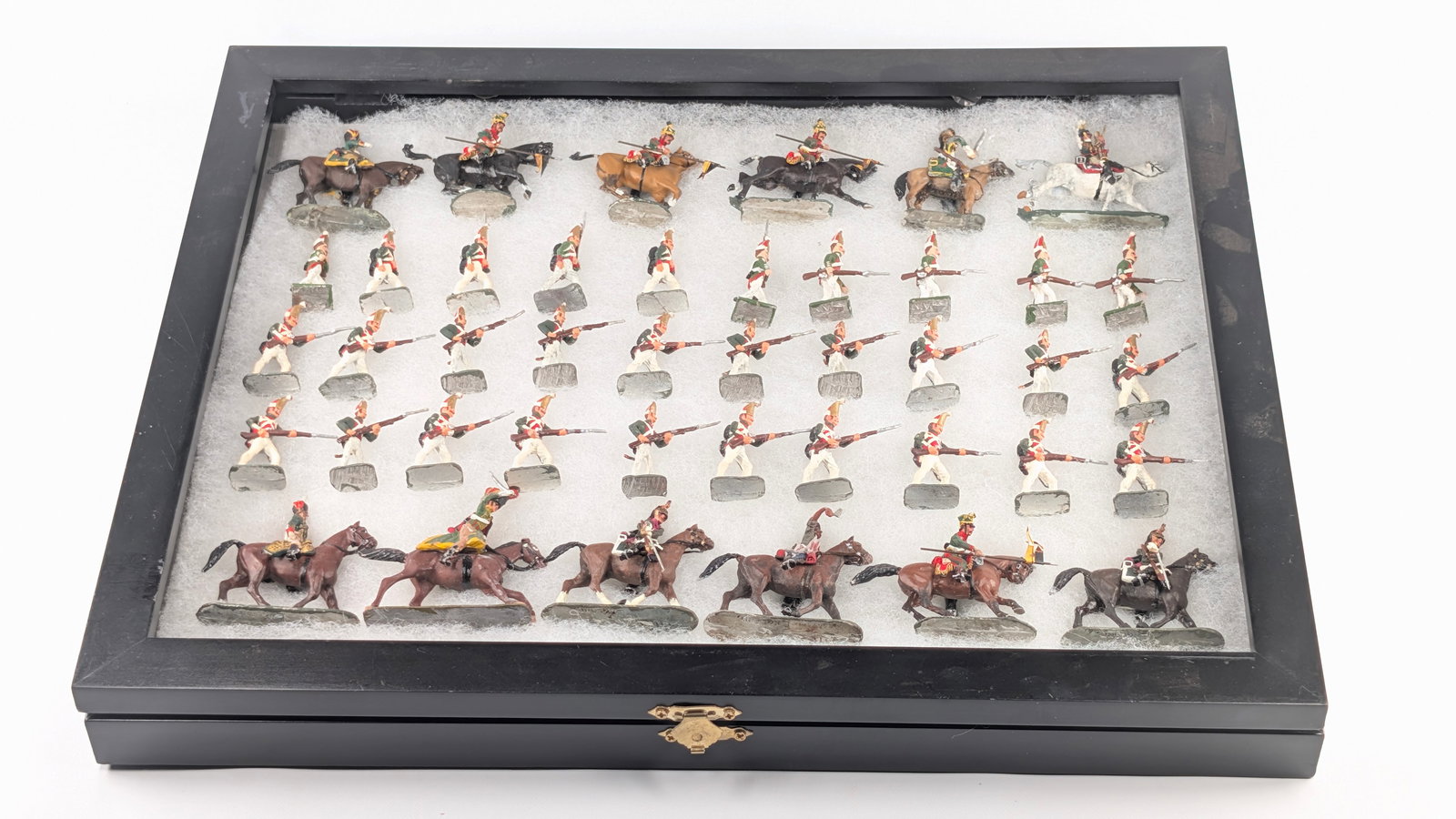 DISPLAY CASE FULL OF UNSIGNED HAND PAINTED LEAD SOLDIERS: INCLUDES ALL SOLDIERS AS SHOWN. ALL REMAIN IN GOOD CONDITION, SHOWING SOME TYPICAL WEAR. INCLUDES CASE.