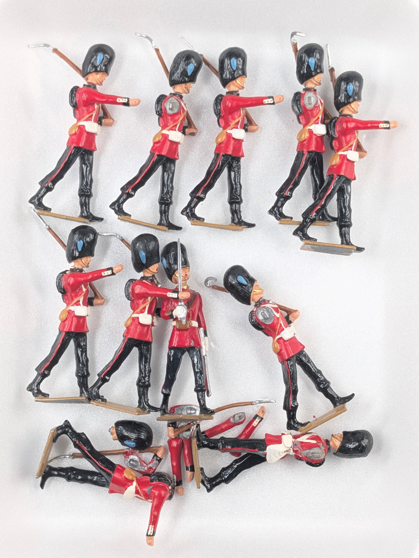 11) HIRIART GUARDS MARCHING: ALL REMAIN IN FAIR TO GOOD CONDITION. ON WITH BROKEN HEAD. SOME LOOSE ARMS.