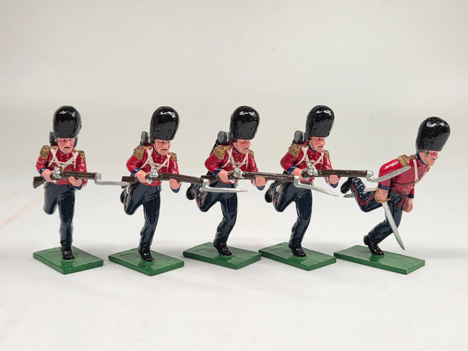 SET OF TROPHY MINIATURES CHARGING SOLDIERS: ALL REMAIN IN GOOD CONDITION, SHOWING SOME LIGHT TYPICAL WEAR.