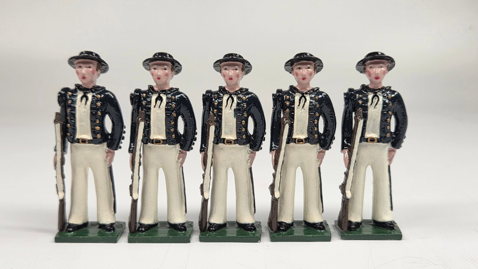 SET OF 5 HAND PAINTED SOLDIERS: ALL REMAIN IN GOOD CONDITION, SHOWING SOME LIGHT TYPICAL WEAR.