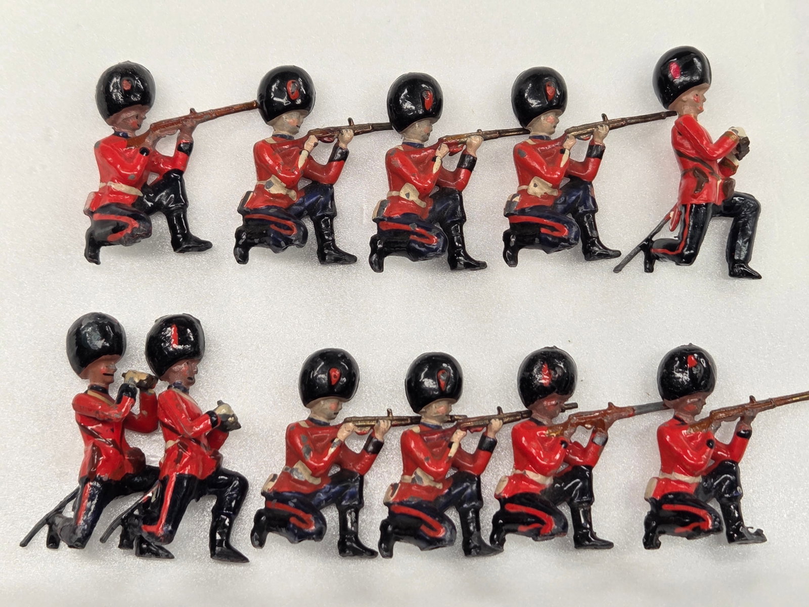11) VINTAGE BRITAIN COLDSTREAM GUARDS: ALL REMAIN IN FAIR TO GOOD CONDITION, SHOWING SOME TYPICAL WEAR.