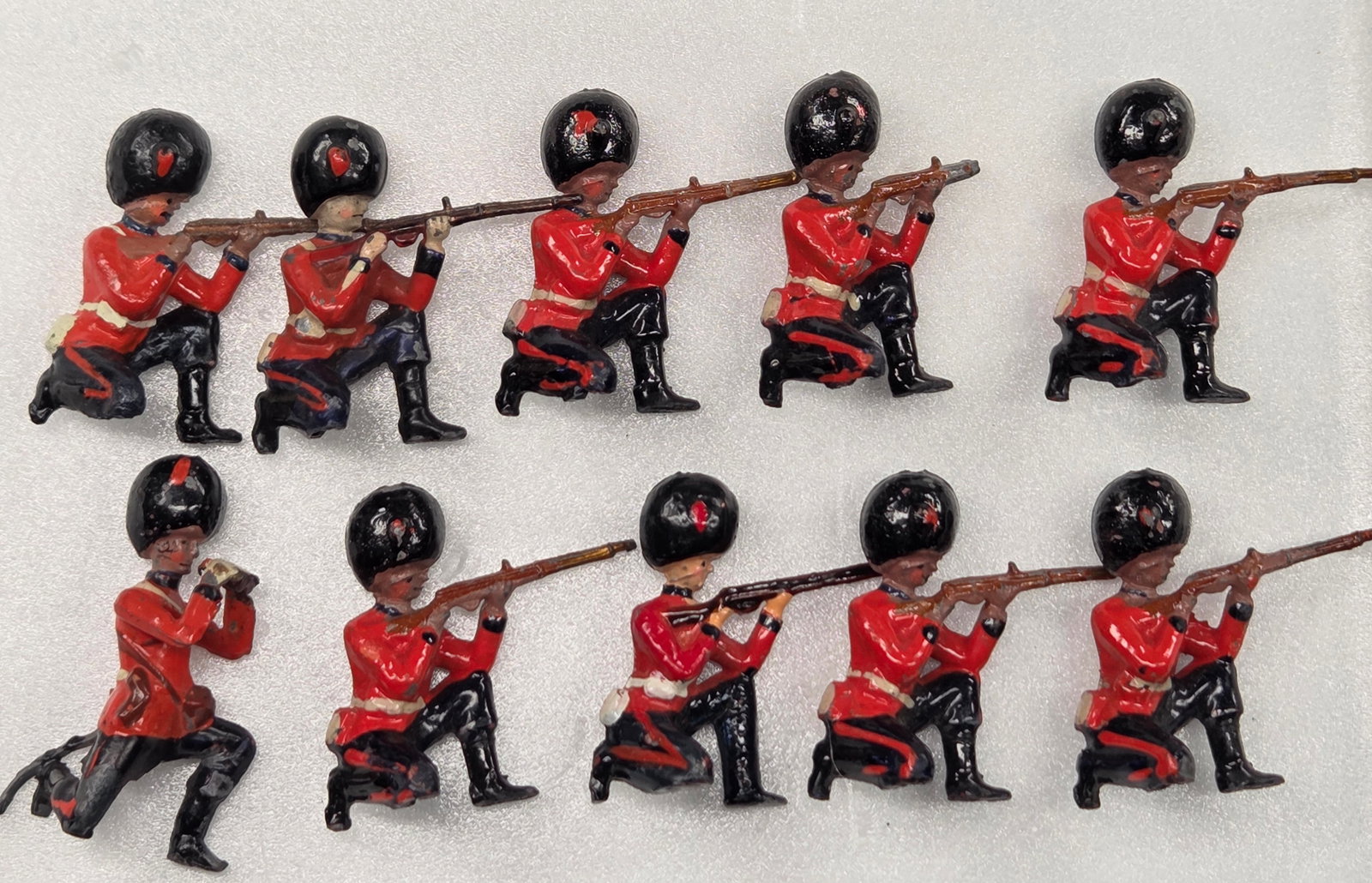 10) VINTAGE BRITAIN COLDSTREAM GUARDS: ALL REMAIN IN FAIR TO GOOD CONDITION, SHOWING SOME TYPICAL WEAR.