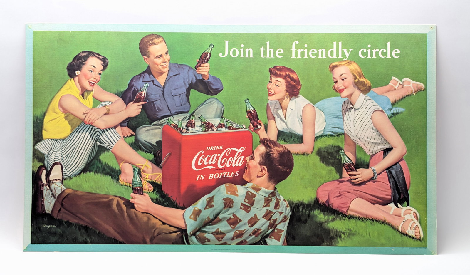 1954 CARDBOARD COCA COLA DISPLAY SIGN: REMAINS IN GOOD CONDITION, SHOWING SOME LIGHT TYPICAL WEAR. SMALL POLES IN EACH CORNER.