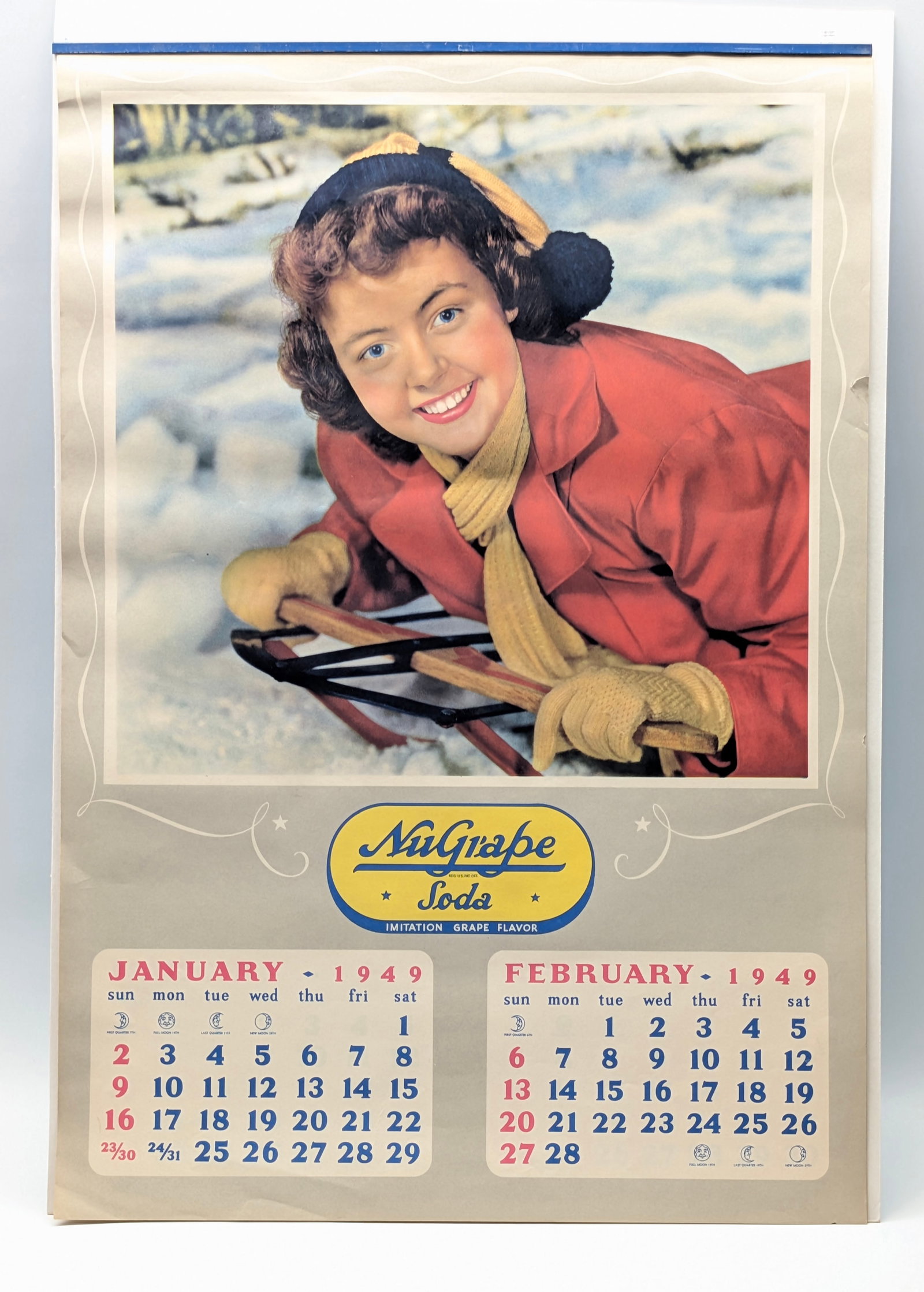 1949 NUGRAPE SODA ADVERTISING CALENDAR: REMAINS IN VERY GOOD CONDITION, SHOWING SOME LIGHT WEAR.