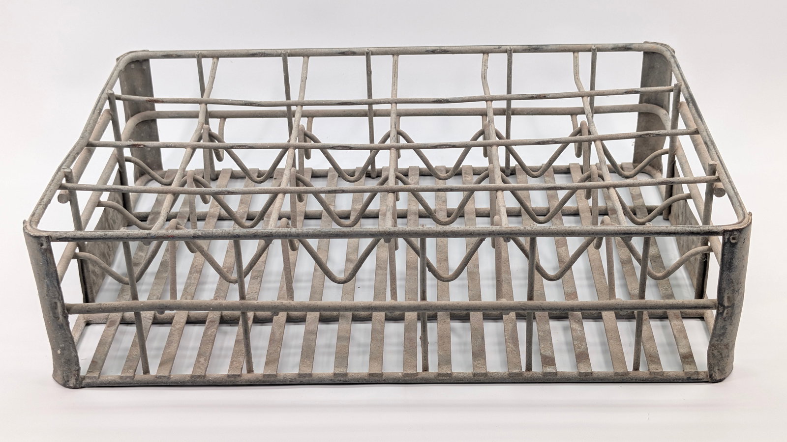 METAL COCA COLA SODA BOTTLE CARRIER TRAY: REMAINS IN FAIR CONDITION, SHOWING WEAR THROUGHOUT.