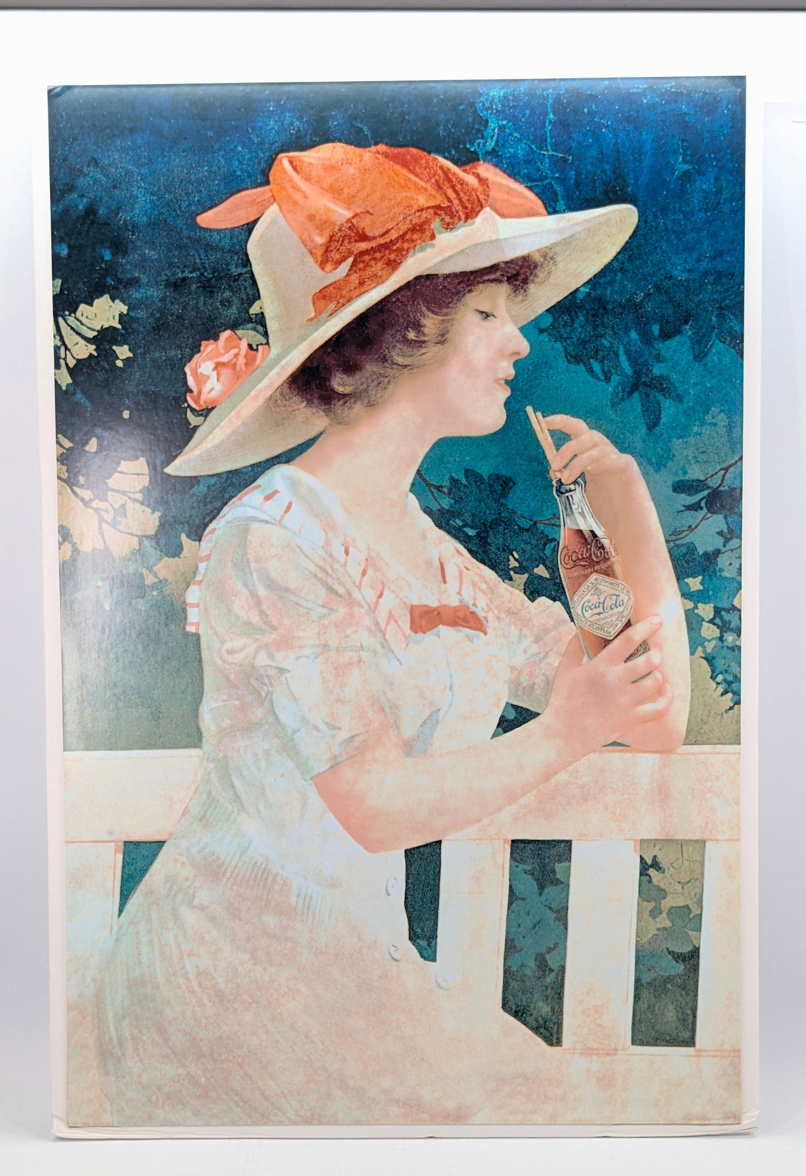 REPRODUCTION COCA COLA PRINT: REMAINS IN GOOD CONDITION, SHOWING SOME EDGE WEAR.