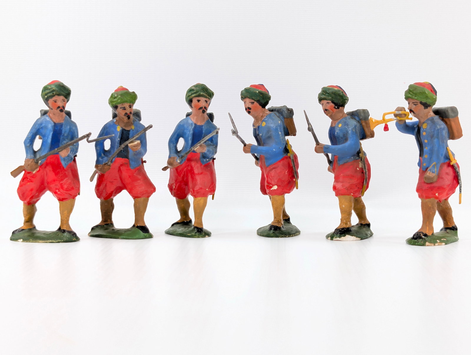 6) ANTIQUE CHALK HAND PAINTED SOLDIERS: ALL REMAIN IN FAIR TO GOOD CONDITION, SHOWING SOME TYPICAL WEAR. A FEW WITH BROKEN RIFLE TIPS. SOME PAINT WEAR AS SHOWN.