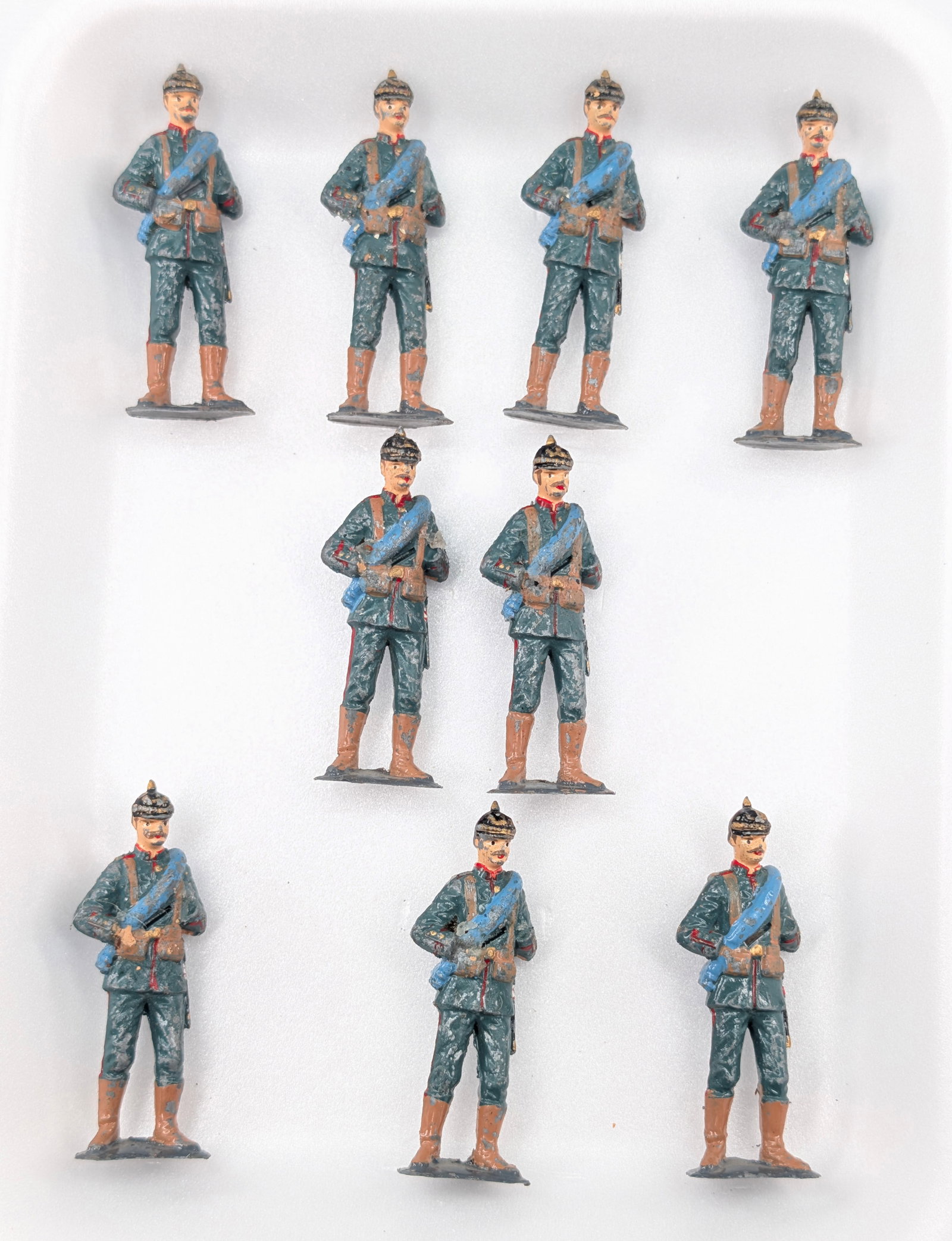 SET OF 9 UNMARKED PRUSSIAN SOLDIERS: ALL REMAIN IN FAIR CONDITION, SHOWING PAINT WEAR.