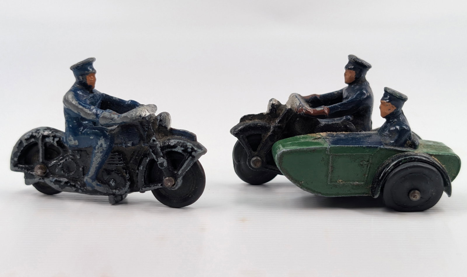 2) DINKY POLICE MOTORCYCLES: BOTH REMAIN IN FAIR TO GOOD CONDITION, SHOWING PAINT WEAR.